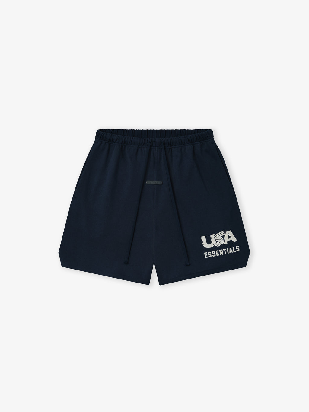 Flat lay of navy blue shorts with elastic waistband, drawstring, and white "USA ESSENTIALS" graphic on front left leg