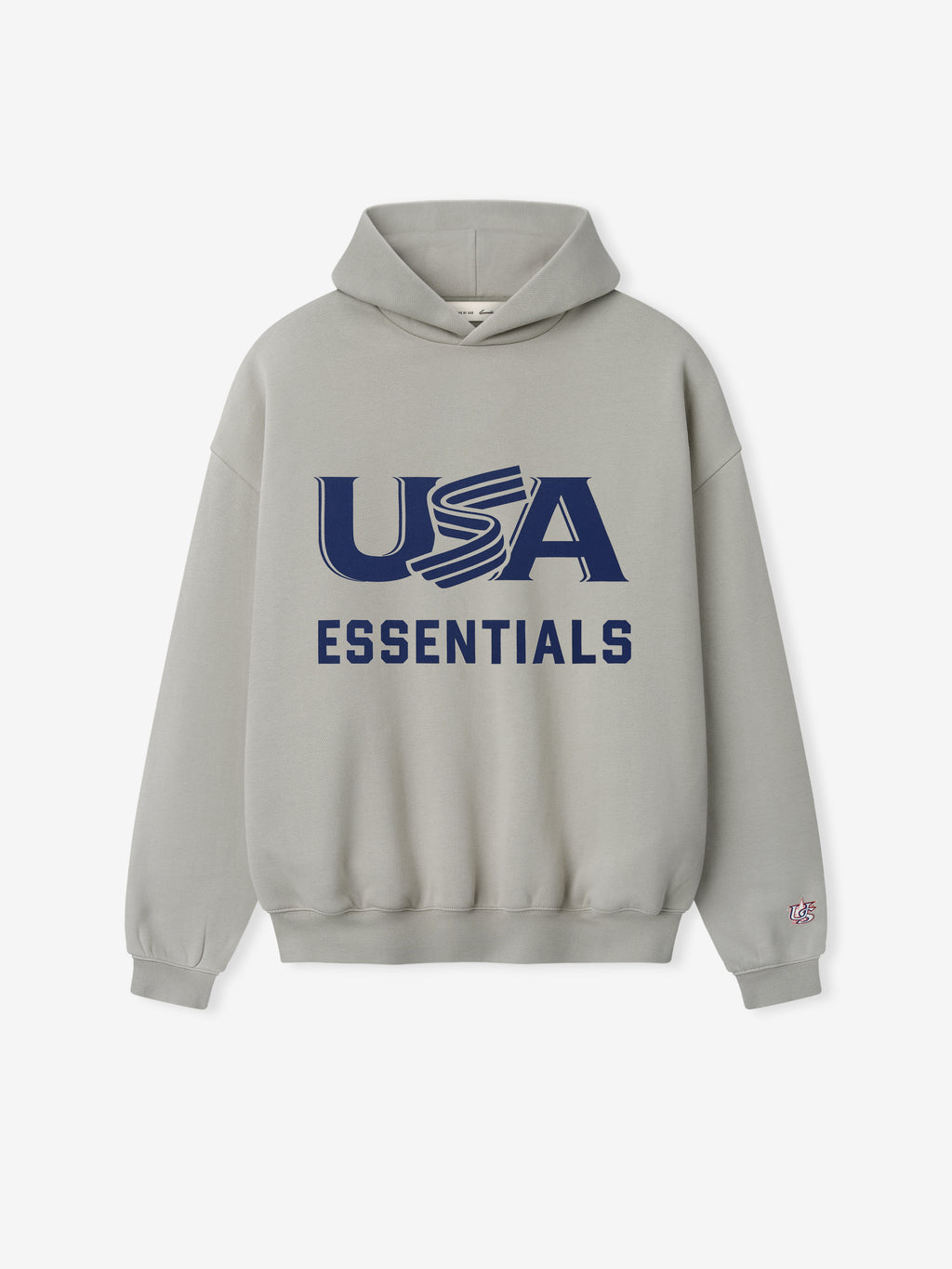 Light gray hoodie with large navy "USA" and bold "ESSENTIALS" text printed on front center and small sleeve patch
