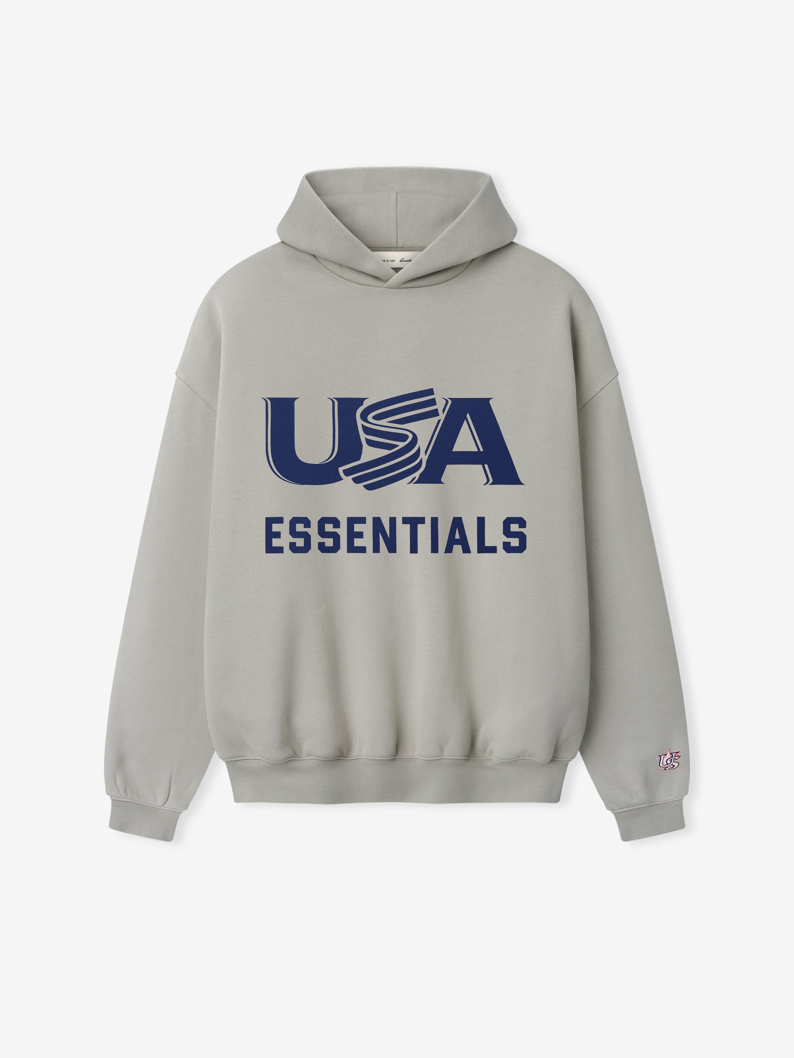 Light gray hoodie with large navy "USA" and bold "ESSENTIALS" text printed on front center and small sleeve patch