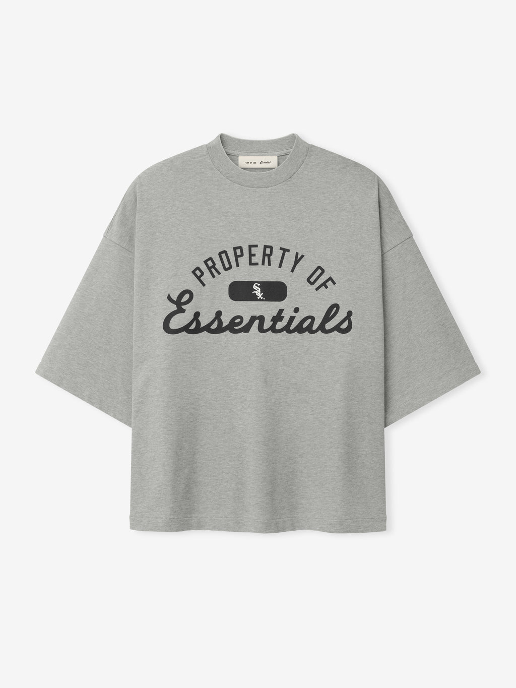 White Sox Merch Tee in concrete heather gray with a relaxed fit, featuring black "Property of Essentials" text and a small team logo on the chest in a casual tee style.