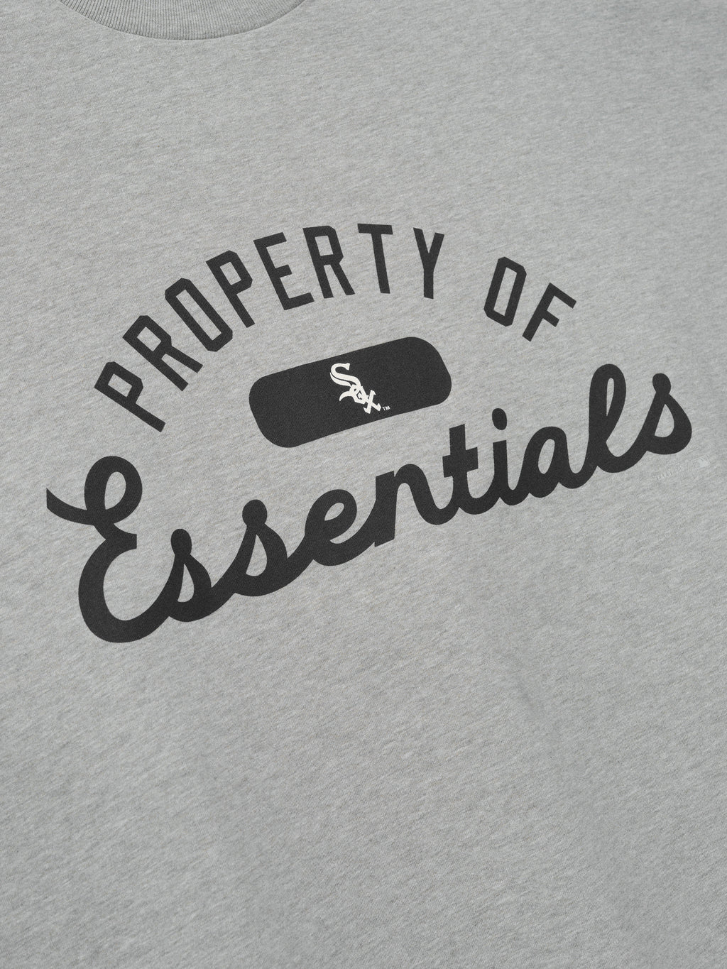 White Sox Merch Tee in light gray fabric featuring bold black "Property of Essentials" text with a small White Sox logo centered for a classic casual top.