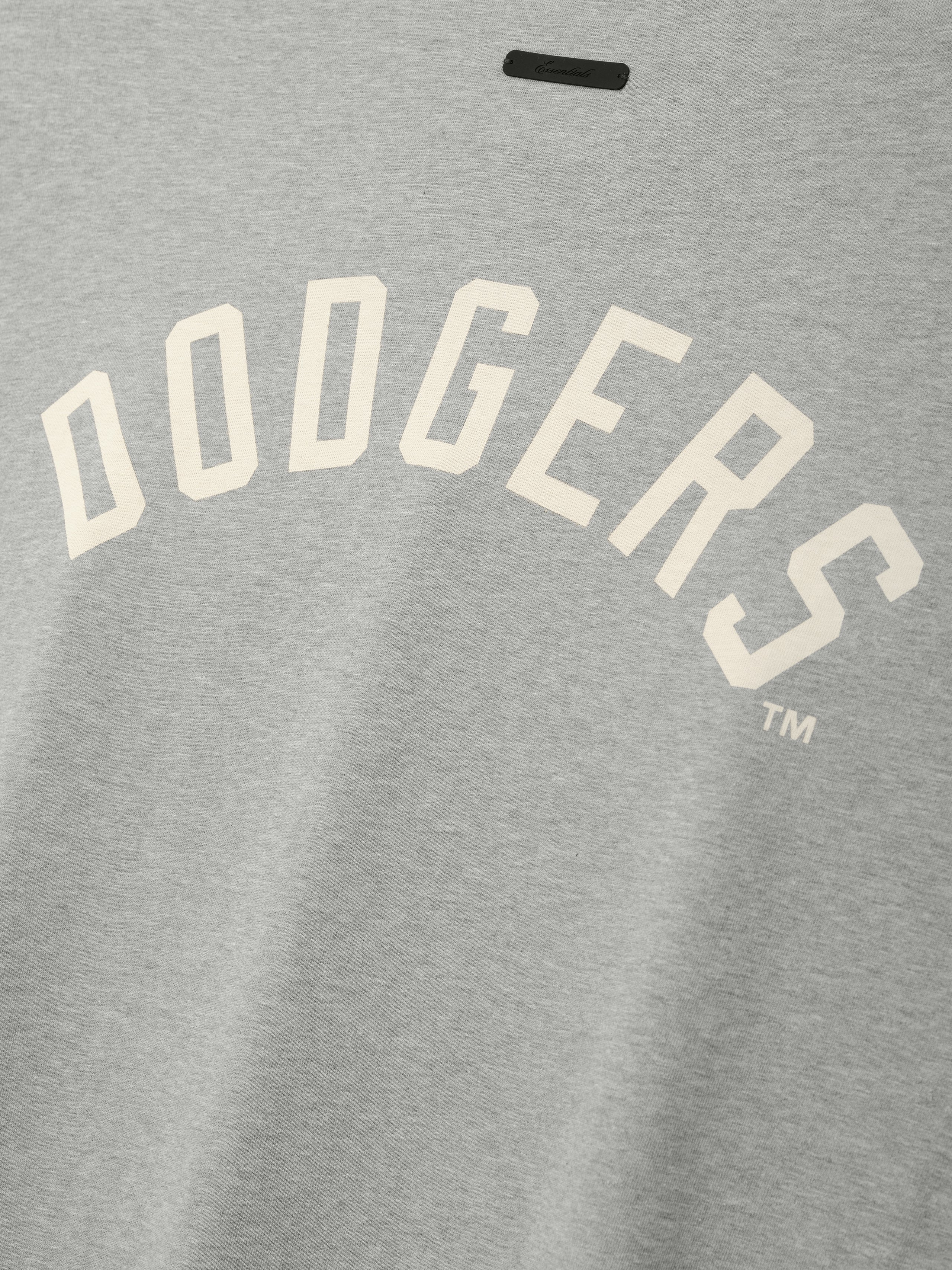 Dodgers Merch Tee in soft concrete heather fabric featuring cream-colored block lettering arched across the chest, designed as a comfortable casual top.