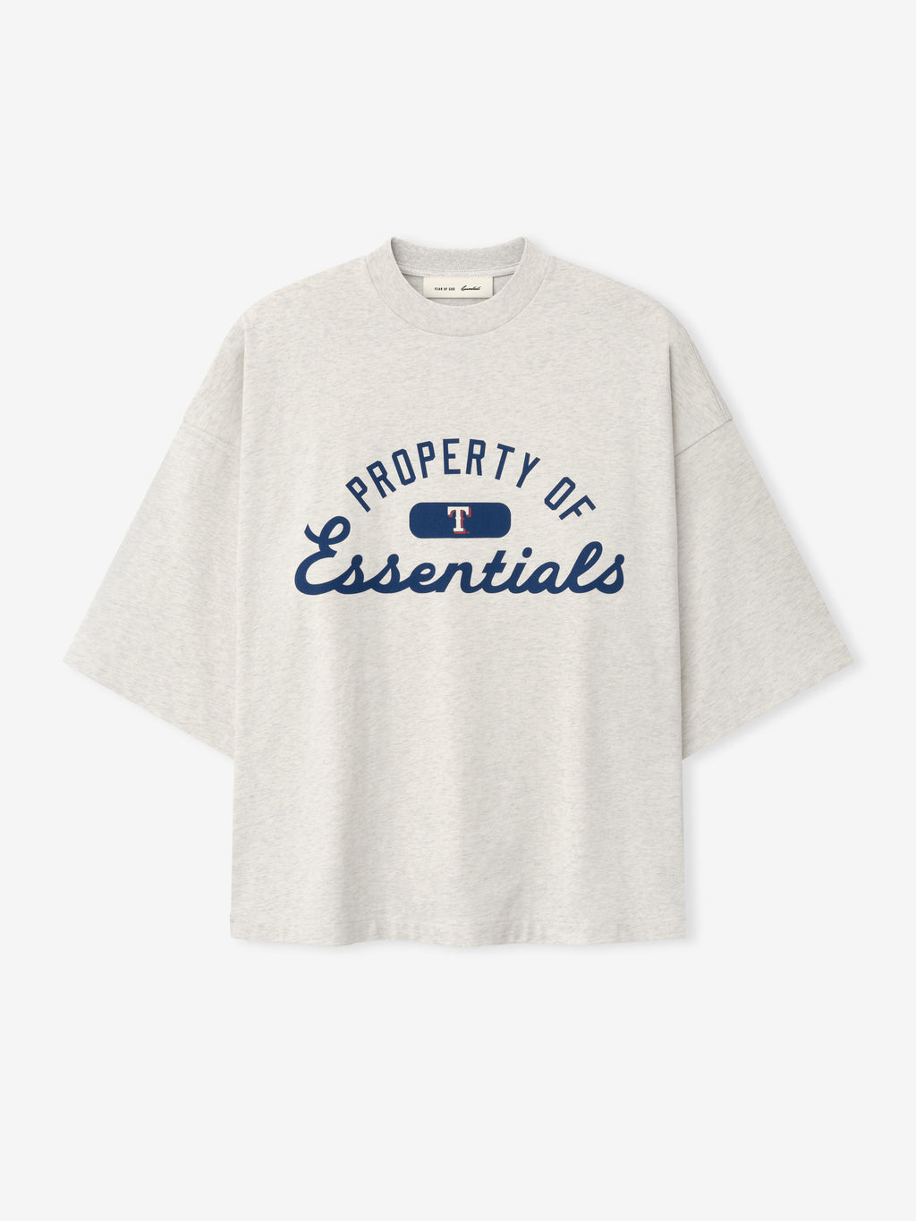 Rangers Merch Tee in a soft oatmeal heather fabric, featuring a navy "Property of Essentials" graphic with a small red and white logo detail on a casual short-sleeve top.