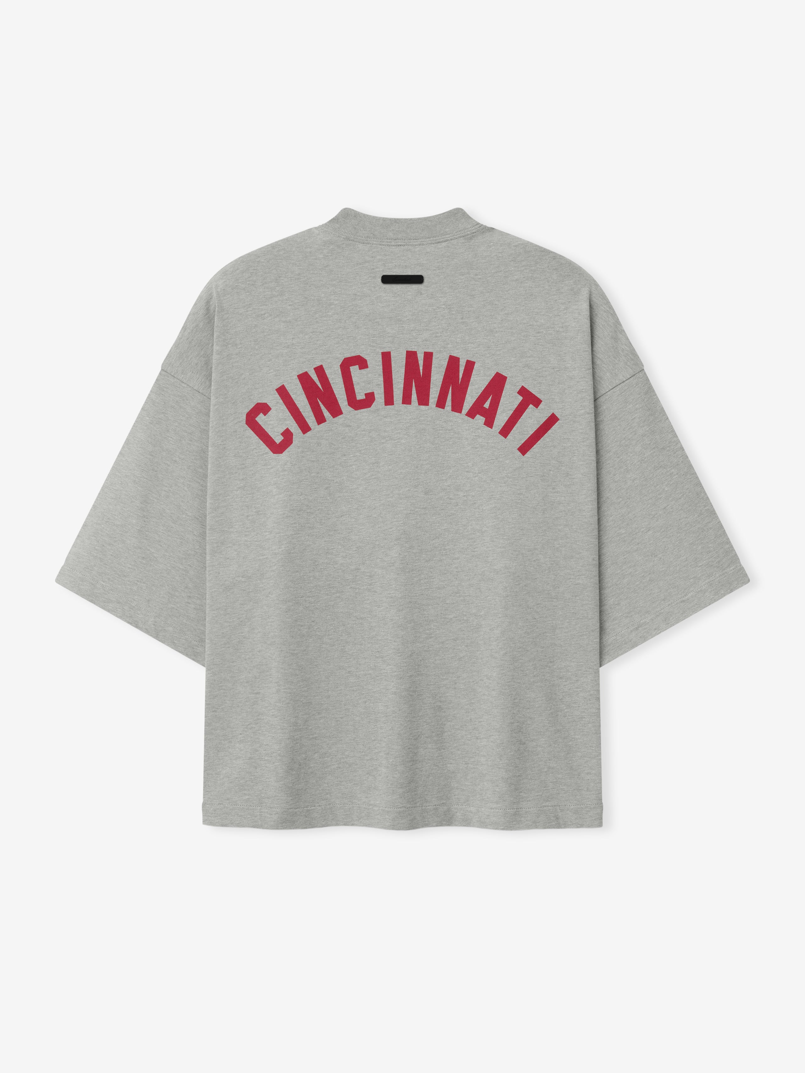 Reds Merch Tee in a soft concrete heather fabric featuring bold red "CINCINNATI" lettering across the back, styled as a relaxed fit casual top.