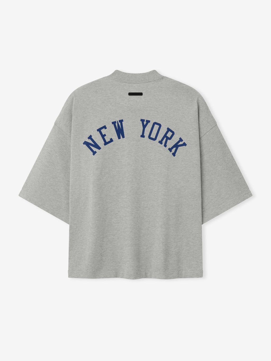 Back view of a grey Mets Merch Tee featuring navy blue "NEW YORK" text in an arched design across the upper back, crafted from soft cotton fabric with a relaxed fit.