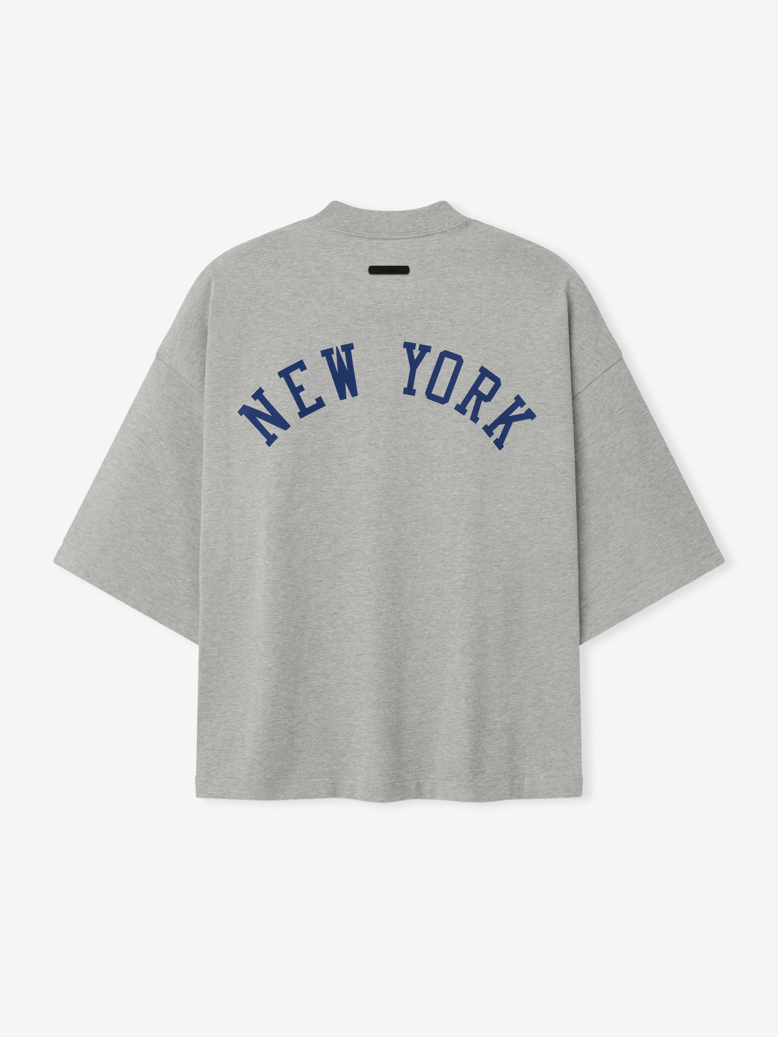 Back view of a grey Mets Merch Tee featuring navy blue "NEW YORK" text in an arched design across the upper back, crafted from soft cotton fabric with a relaxed fit.