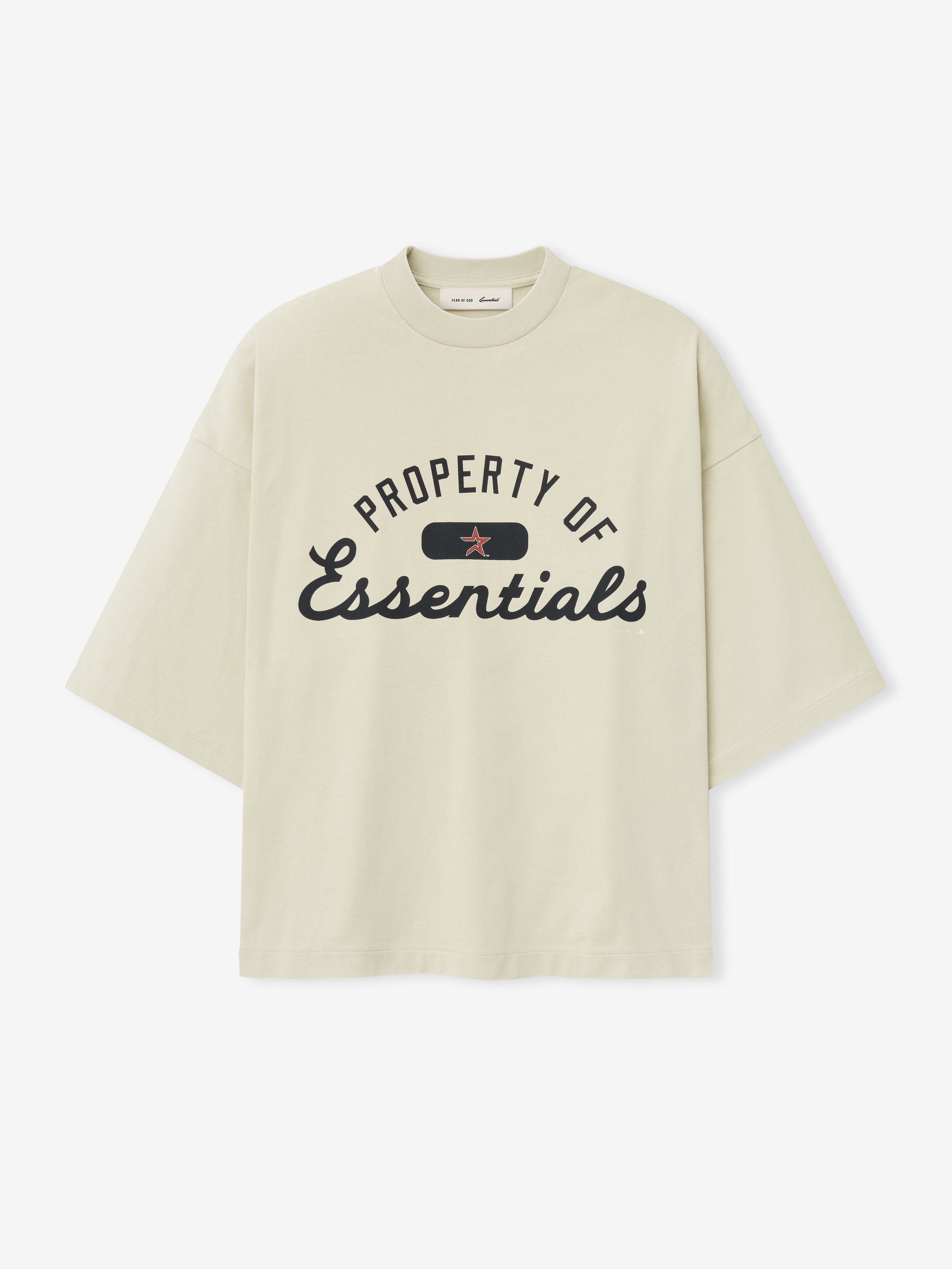 Astros Merch Tee in a light sandstone color with a relaxed fit, featuring bold black script text stating "Property of Essentials" and a small red star accent in the center.