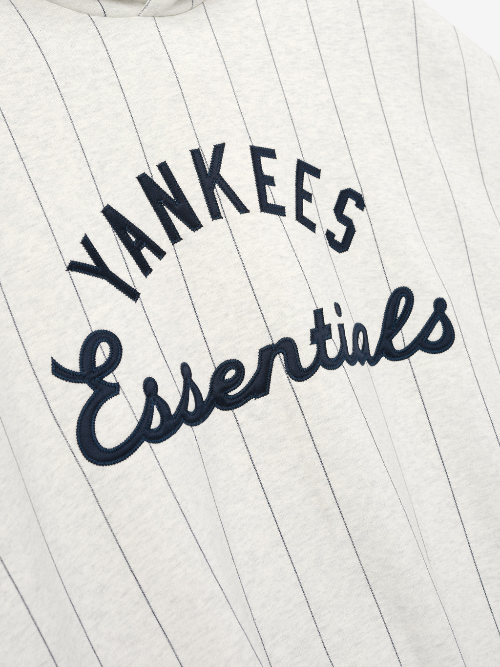 'Yankees Essentials' on a white background with black embroidery