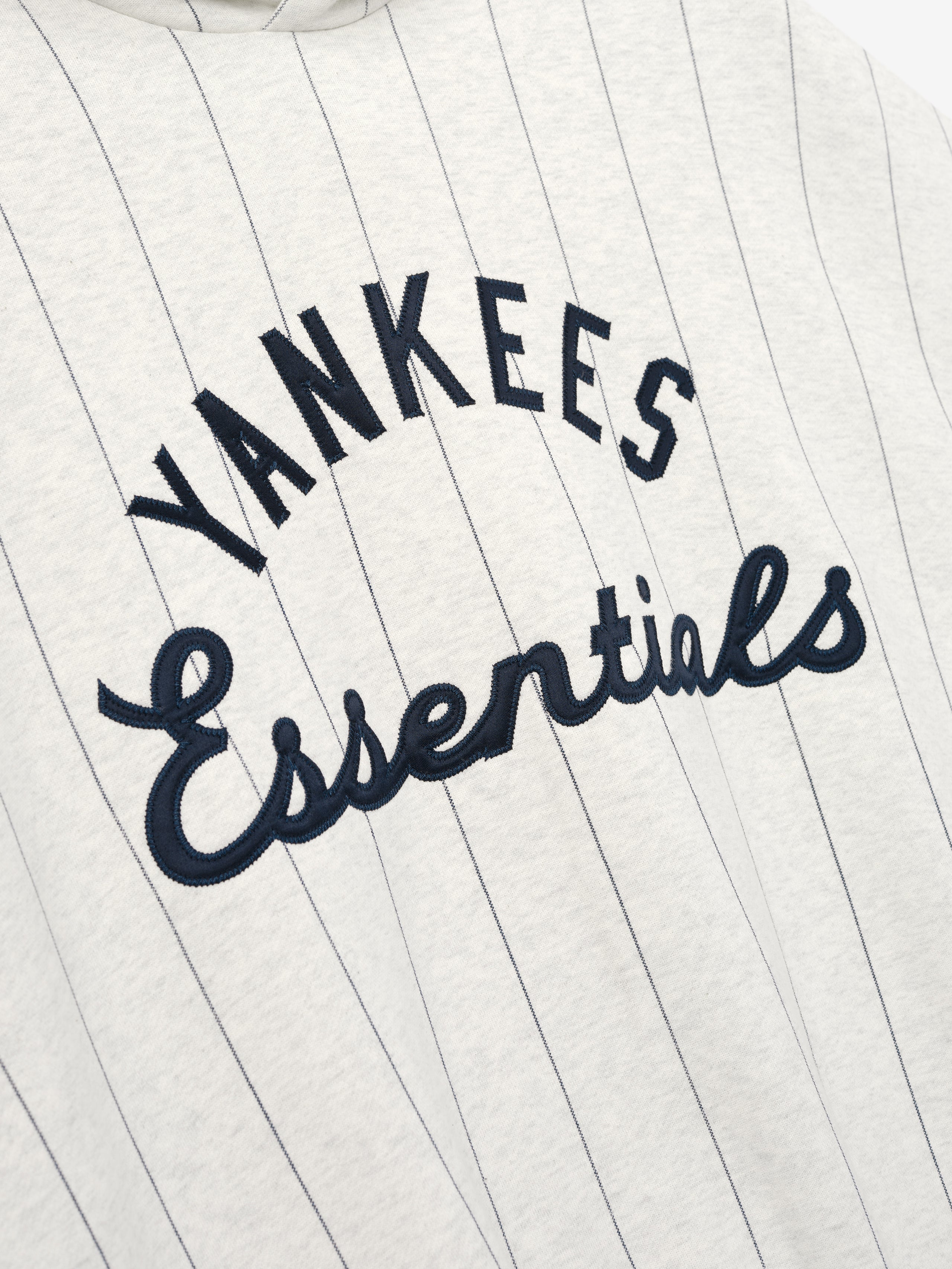 'Yankees Essentials' on a white background with black embroidery