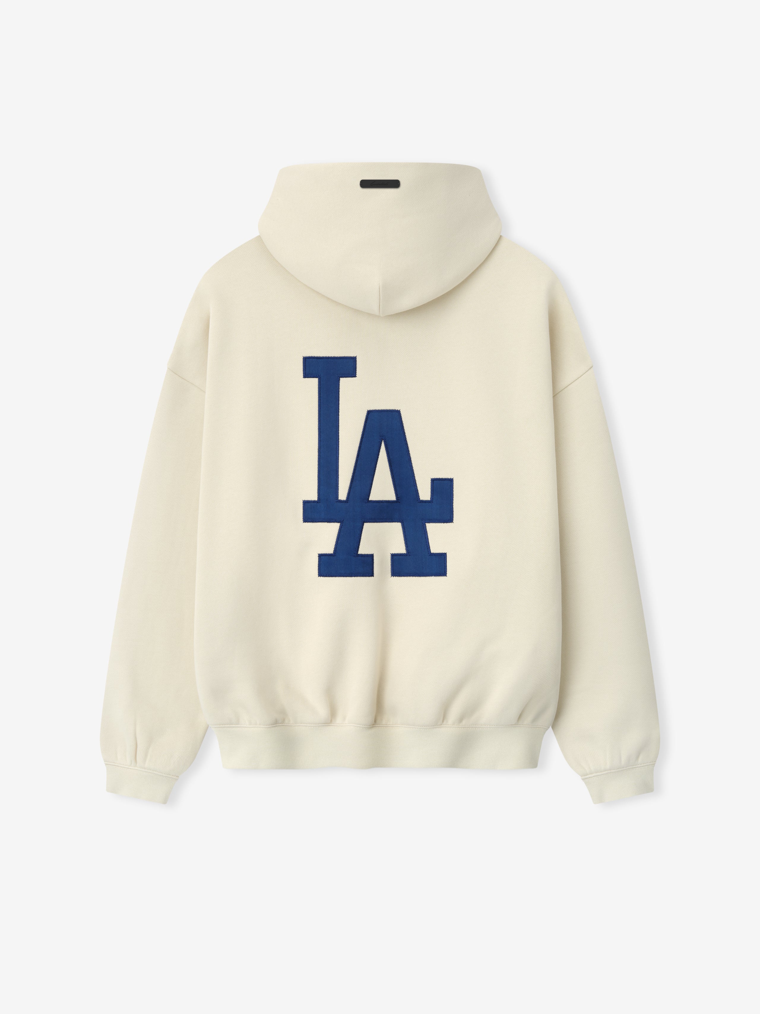 Dodgers Sport Hoodie in a soft cream shade featuring a large navy blue LA logo on the back, designed with ribbed cuffs and hem for a comfortable outerwear fit.