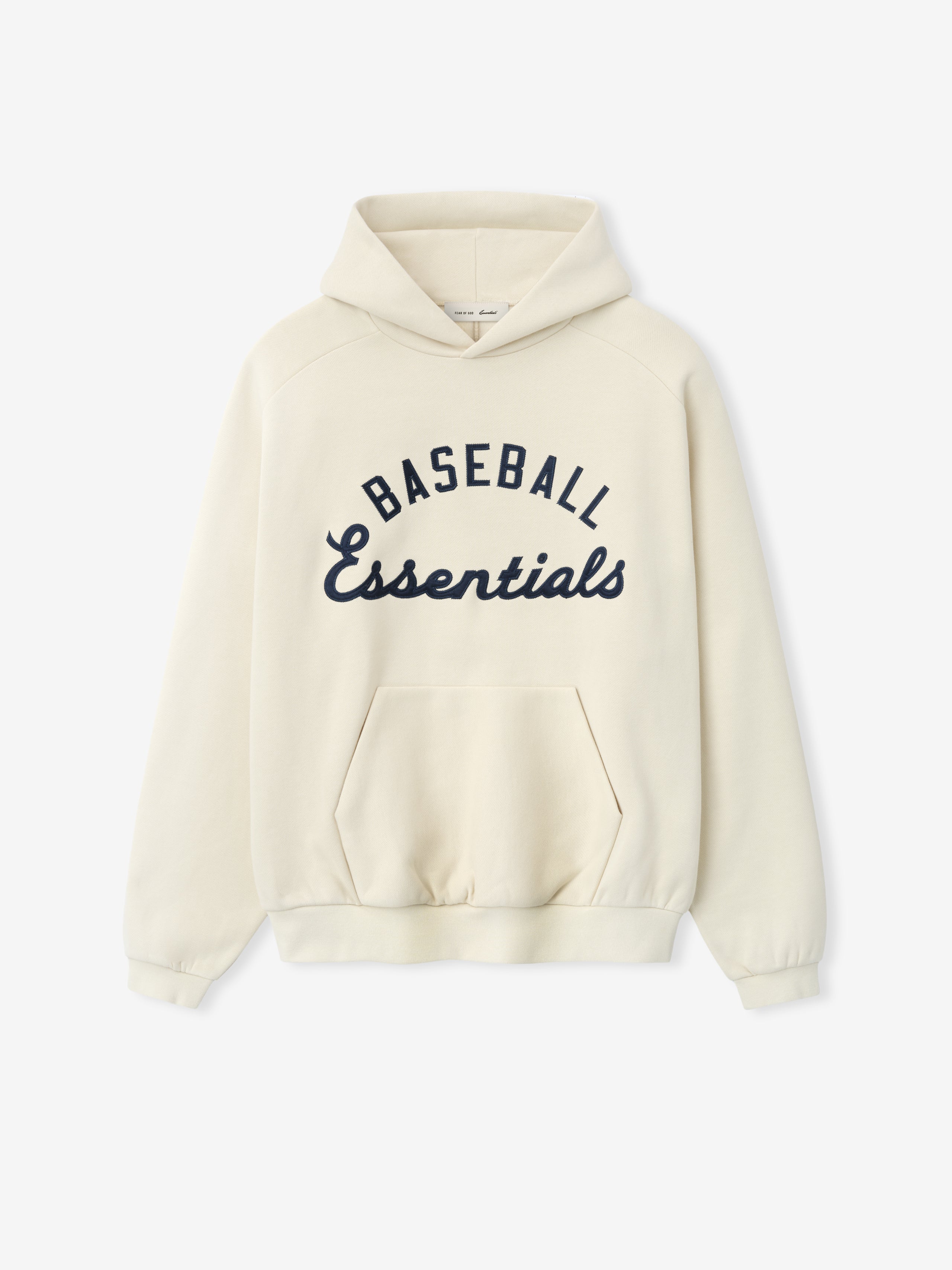 MLB Raglan Sport Hoodie in a soft off-white with navy "Baseball Essentials" script across the chest, featuring a front kangaroo pocket and roomy hood in cozy outerwear style.