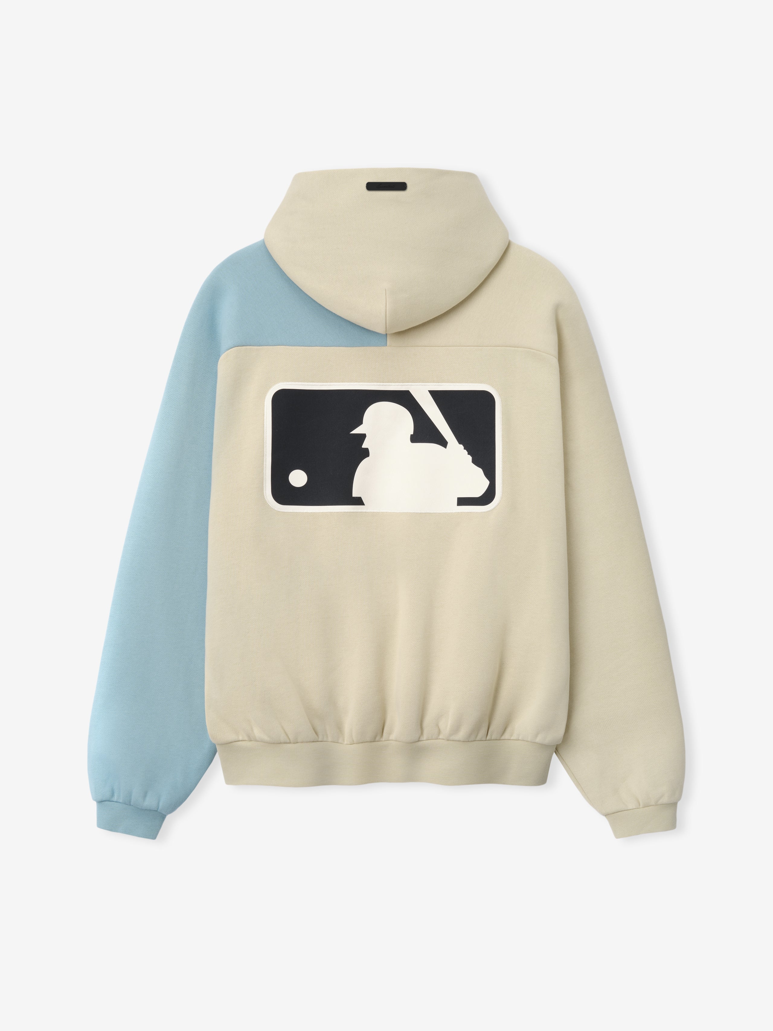 Mlb Raglan Sport Hoodie in a soft sandstone color with a contrasting light blue sleeve, featuring a large baseball batter silhouette graphic on the back, designed as casual outerwear.