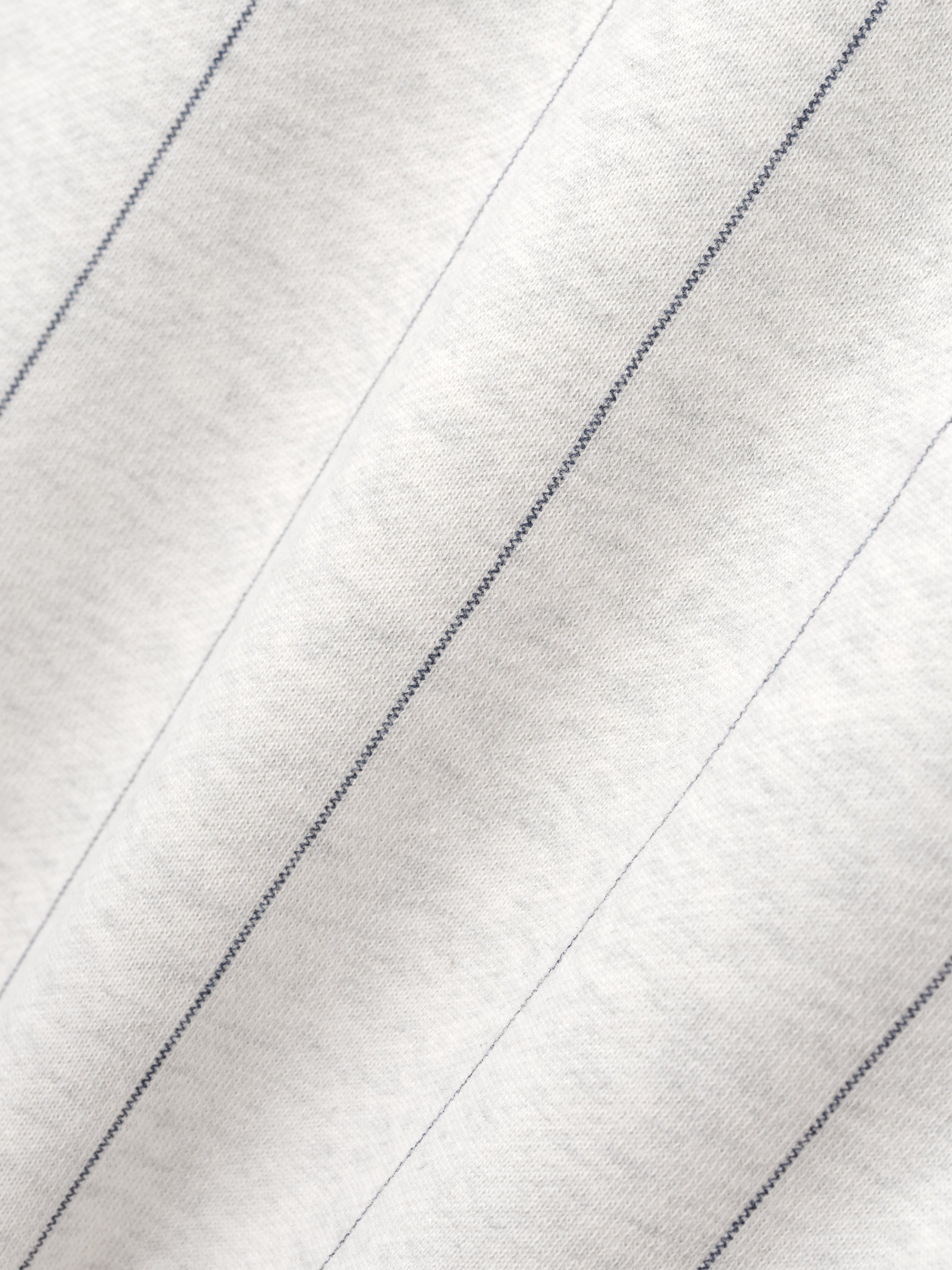 Close-up of a textured white fabric with diagonal lines
