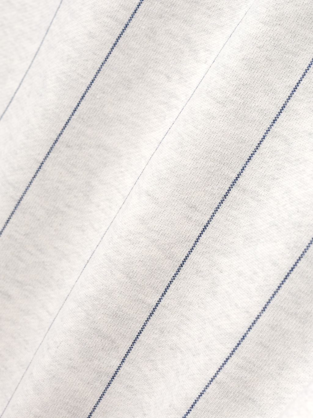 Close-up of a white fabric with blue stripes