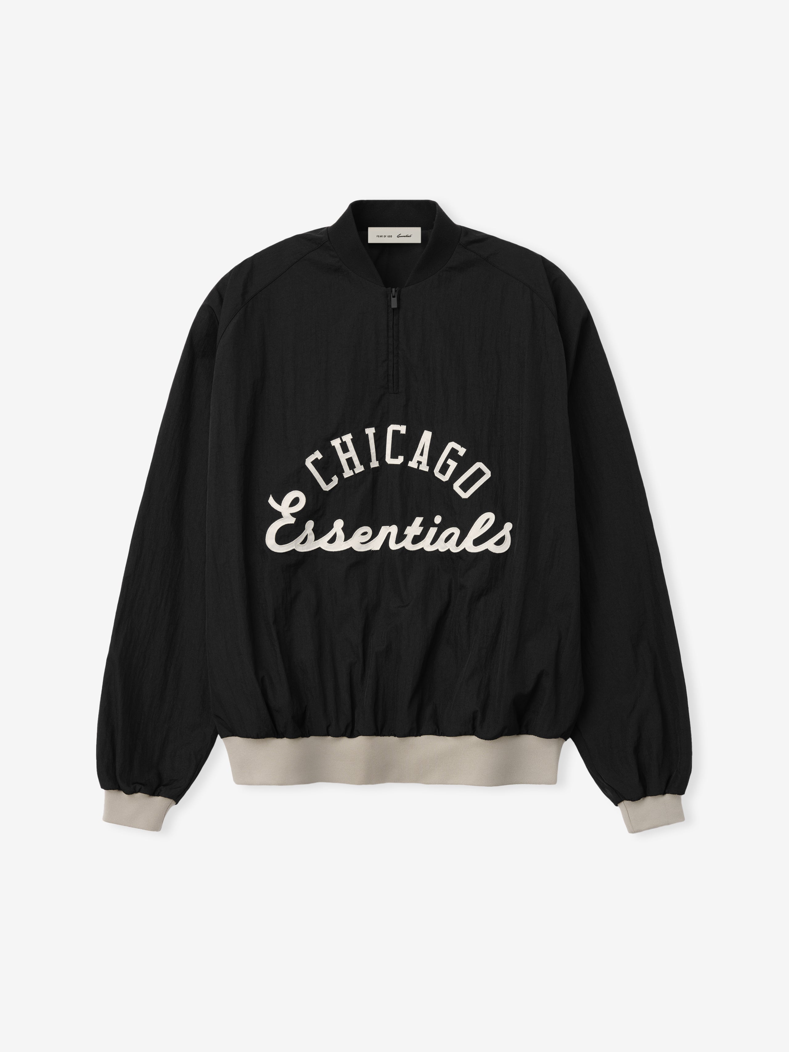 White Sox Half Zip Pullover in black with white "Chicago Essentials" script on the front, featuring beige ribbed cuffs and waistband for a relaxed fit outerwear top.