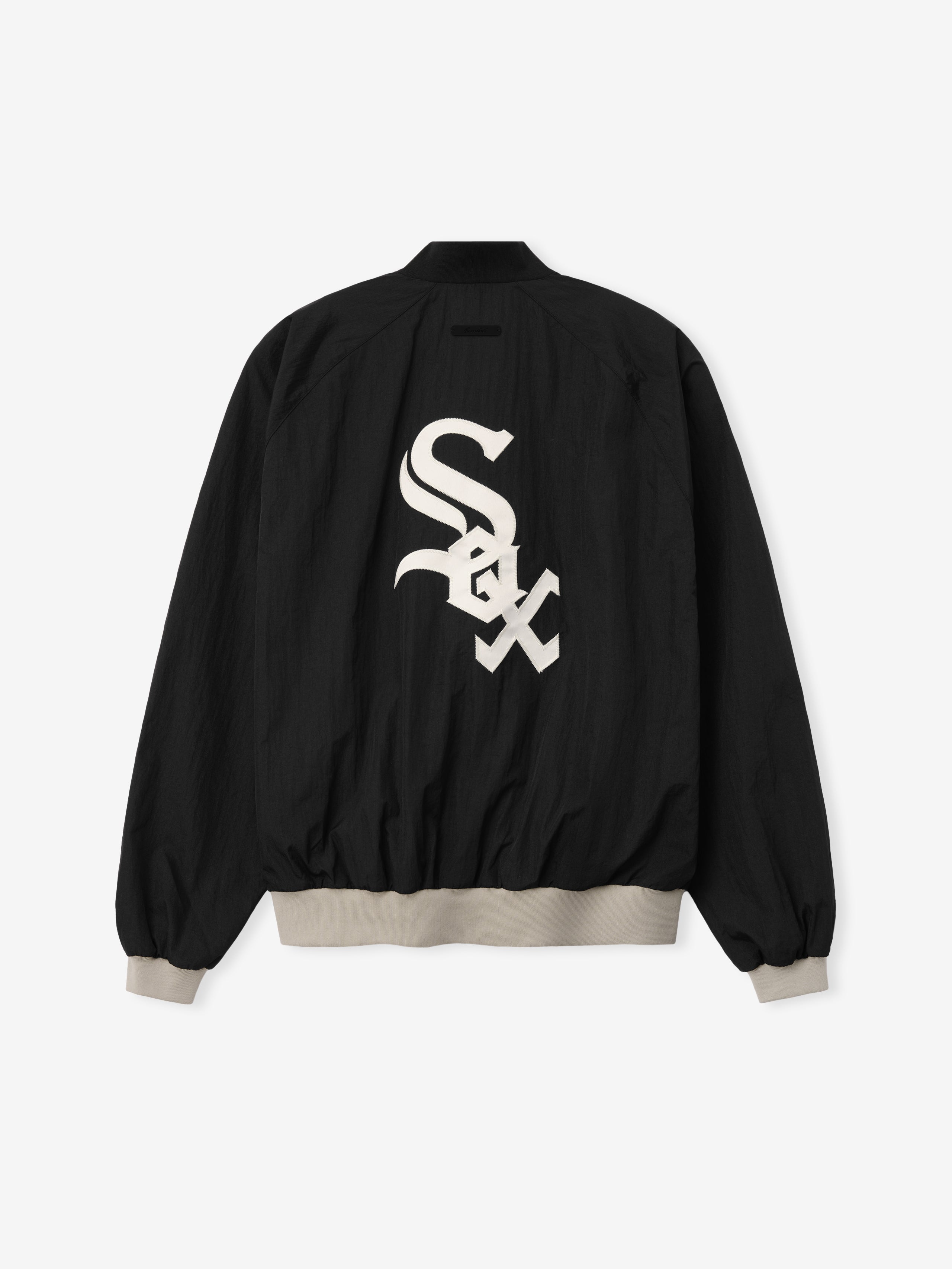 White Sox Half Zip Pullover in black featuring a large white team logo on the back, with beige ribbed cuffs and waistband for a relaxed fit outerwear top.