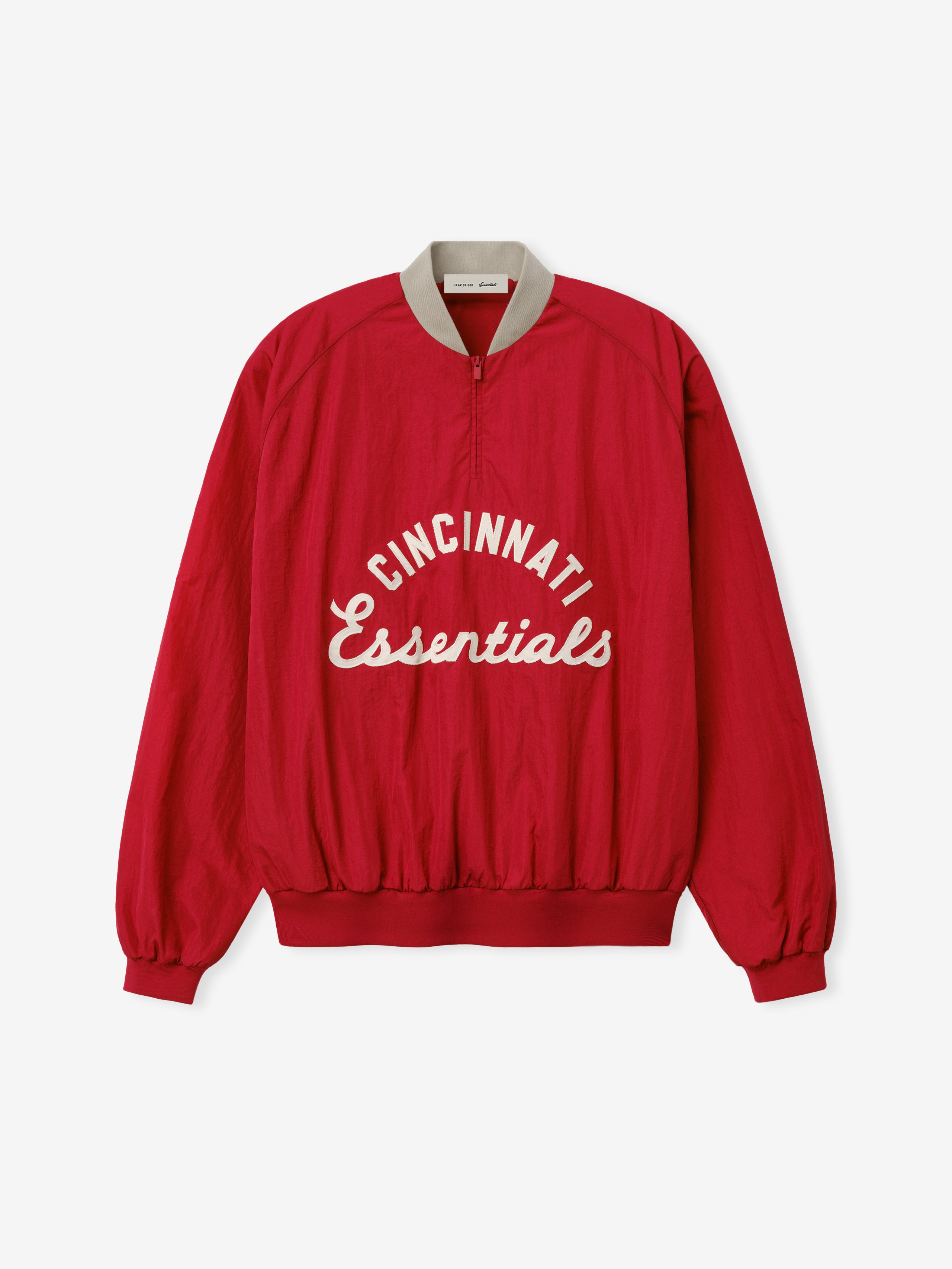 Reds Half Zip Pullover in a rich stone red shade with contrasting light collar, featuring "Cincinnati Essentials" lettering, designed as a casual, relaxed fit outerwear top.