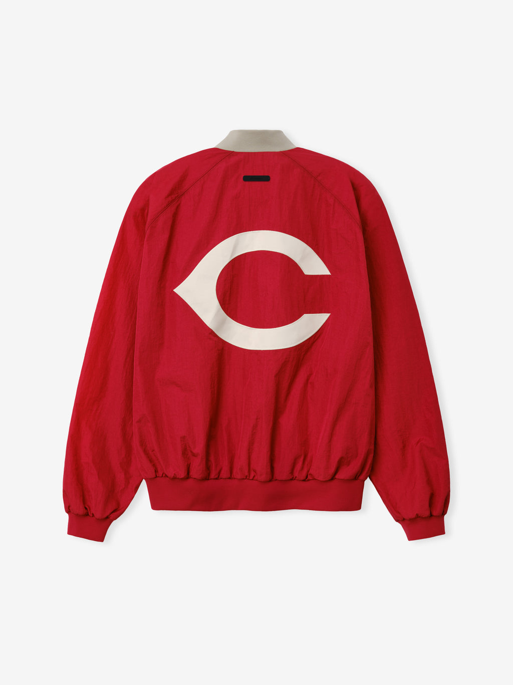 Reds Half Zip Pullover in a bold stone red color featuring a large white Cincinnati-inspired emblem on the back, designed as a lightweight outerwear piece with elasticated cuffs and hem.