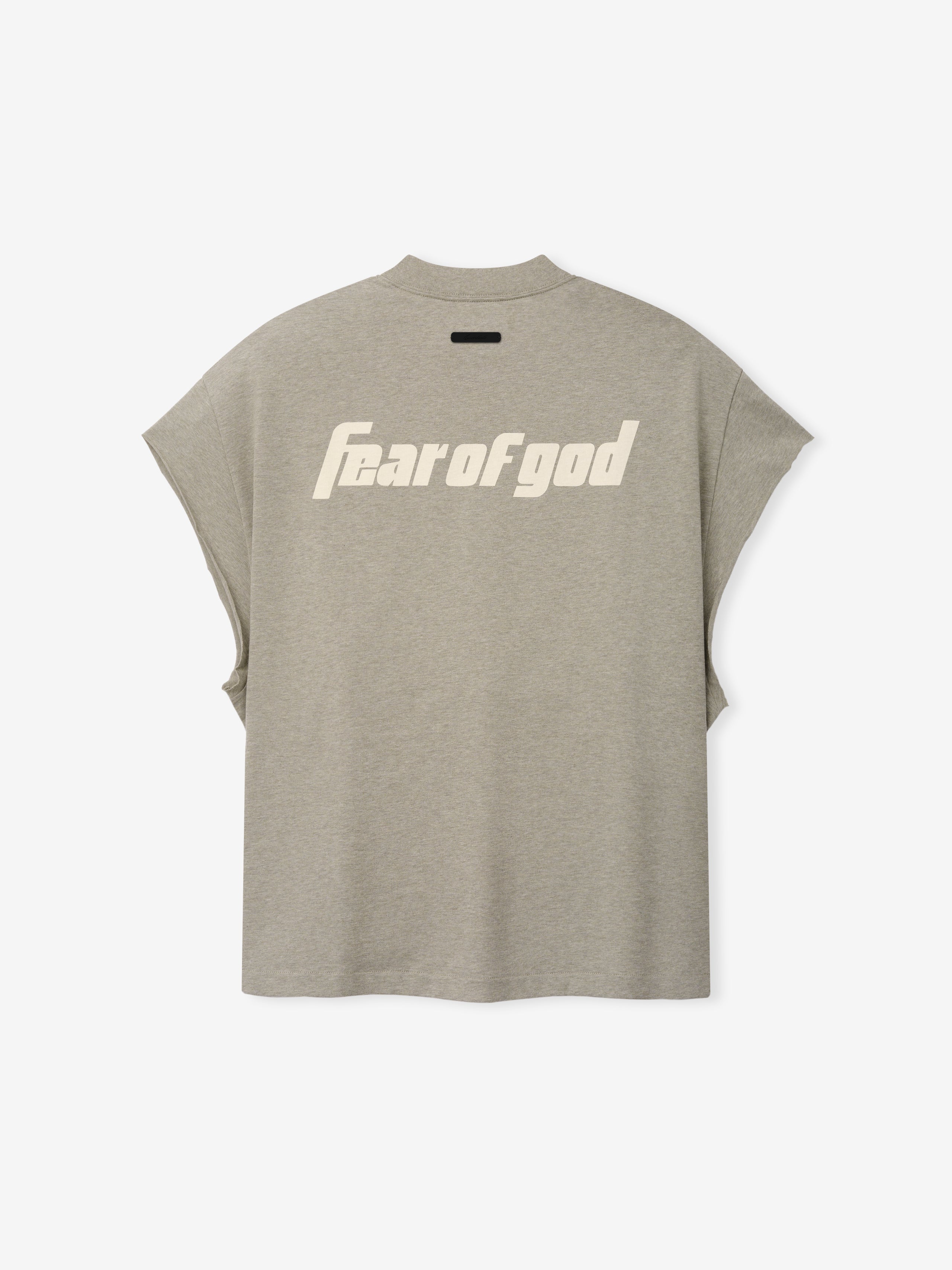 Back view of the Fear Of God X Franklin 90s Cutoff in muted beige heather, featuring bold cream "Fear of God" text across the upper back on soft fabric with capped sleeves.