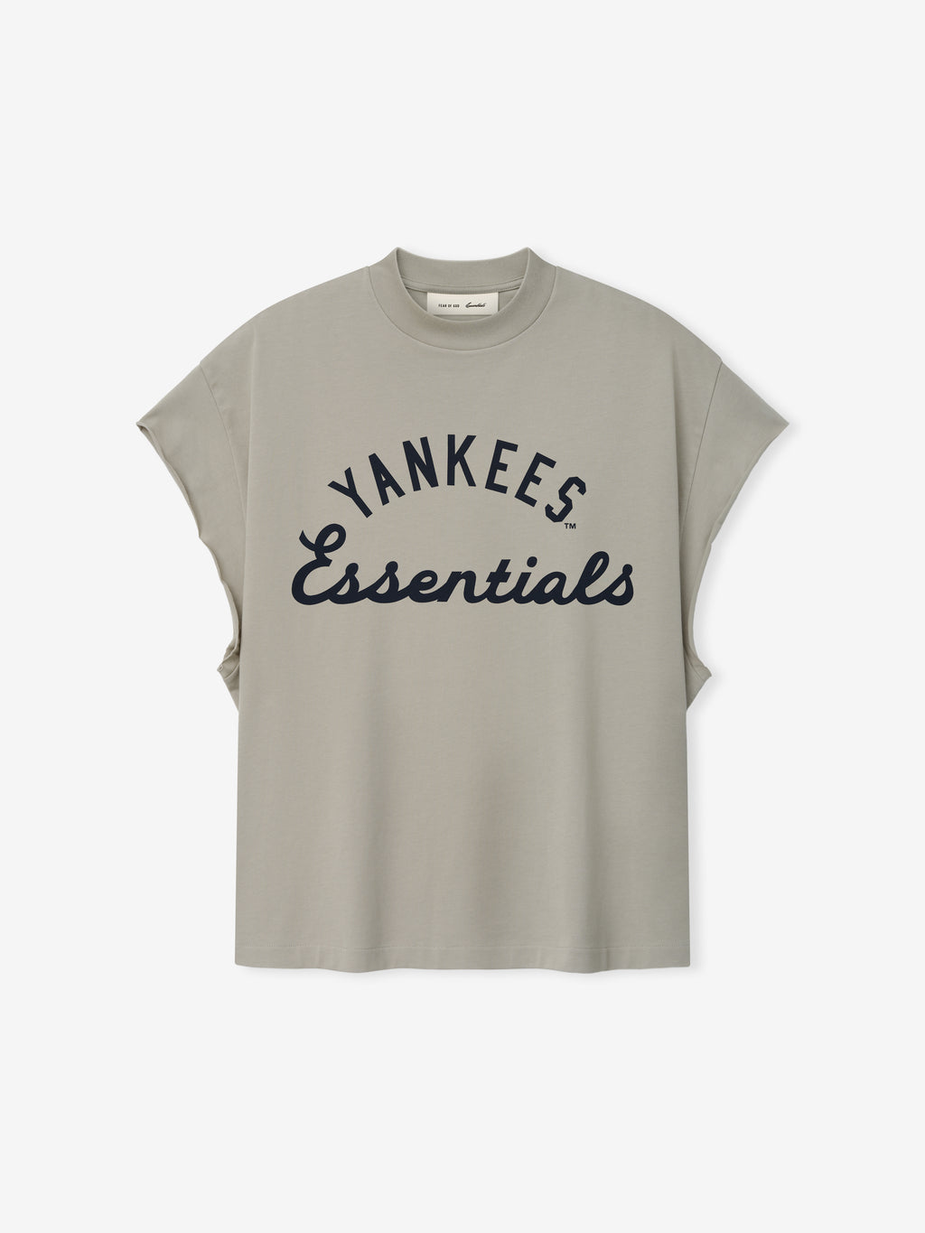 Yankees 90s Cut Off in muted gray featuring a relaxed fit with wide arm openings and bold navy "Yankees Essentials" text across the front on a soft cotton top.