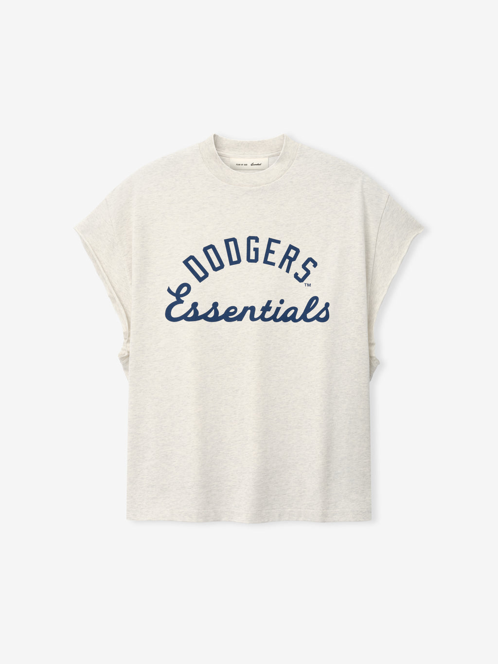 Front view of a light oatmeal-colored Dodgers 90s Cut Off top featuring navy blue "Dodgers Essentials" text in a bold and cursive mix on soft fabric with dropped shoulders.