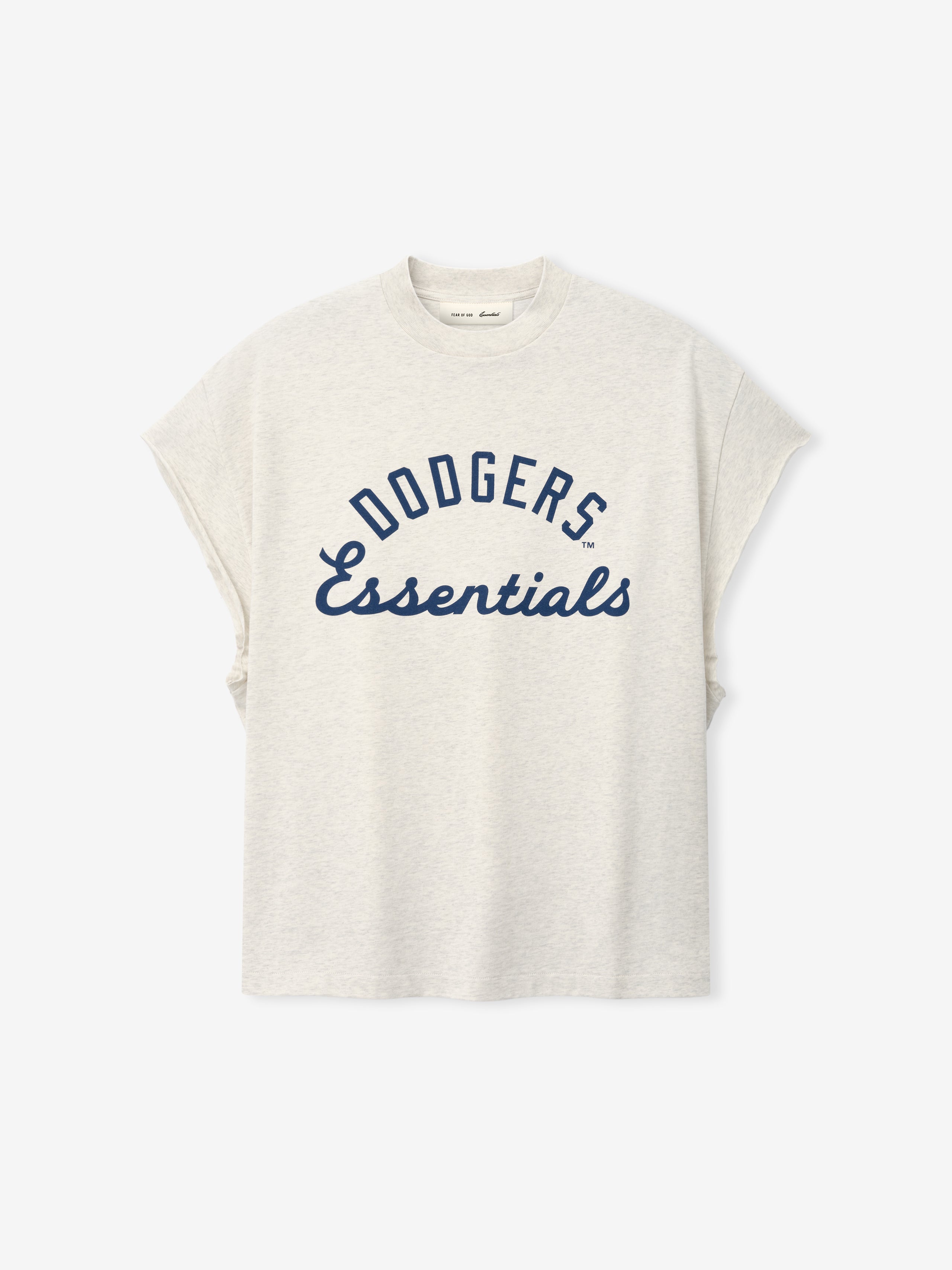 Front view of a light oatmeal-colored Dodgers 90s Cut Off top featuring navy blue "Dodgers Essentials" text in a bold and cursive mix on soft fabric with dropped shoulders.
