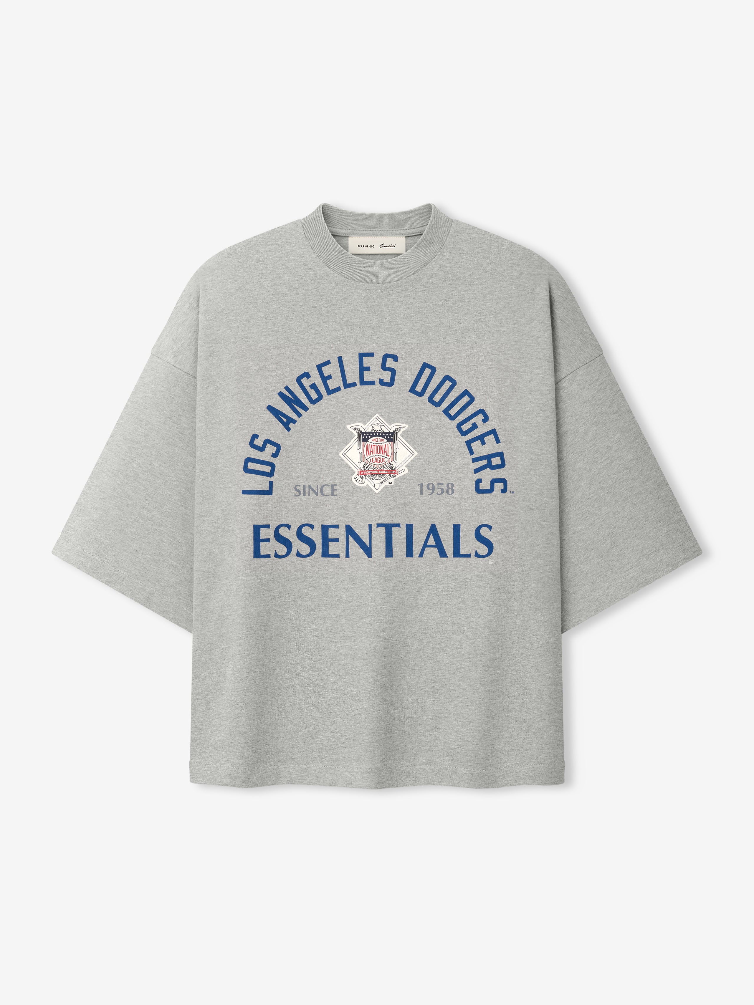 Front view of Dodgers NL Merch Tee in concrete heather gray featuring oversized fit, dropped shoulders, and navy blue "Los Angeles Dodgers Essentials" text with logo graphic on soft fabric.