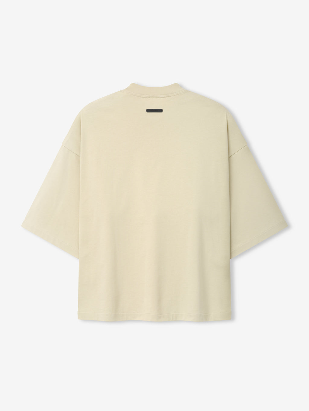 Back view of a cream-colored oversized short-sleeve top with a relaxed fit and minimalistic design, part of the Astros Al Merch Tee collection.