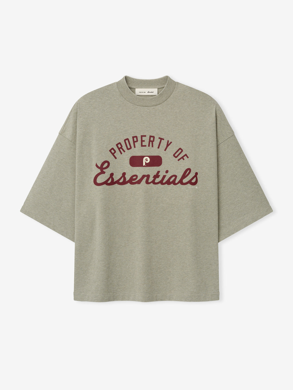 Phillies Merch Tee in a muted gray-green shade featuring maroon "Property of Essentials" text and logo across the chest, designed as a relaxed-fit casual top.
