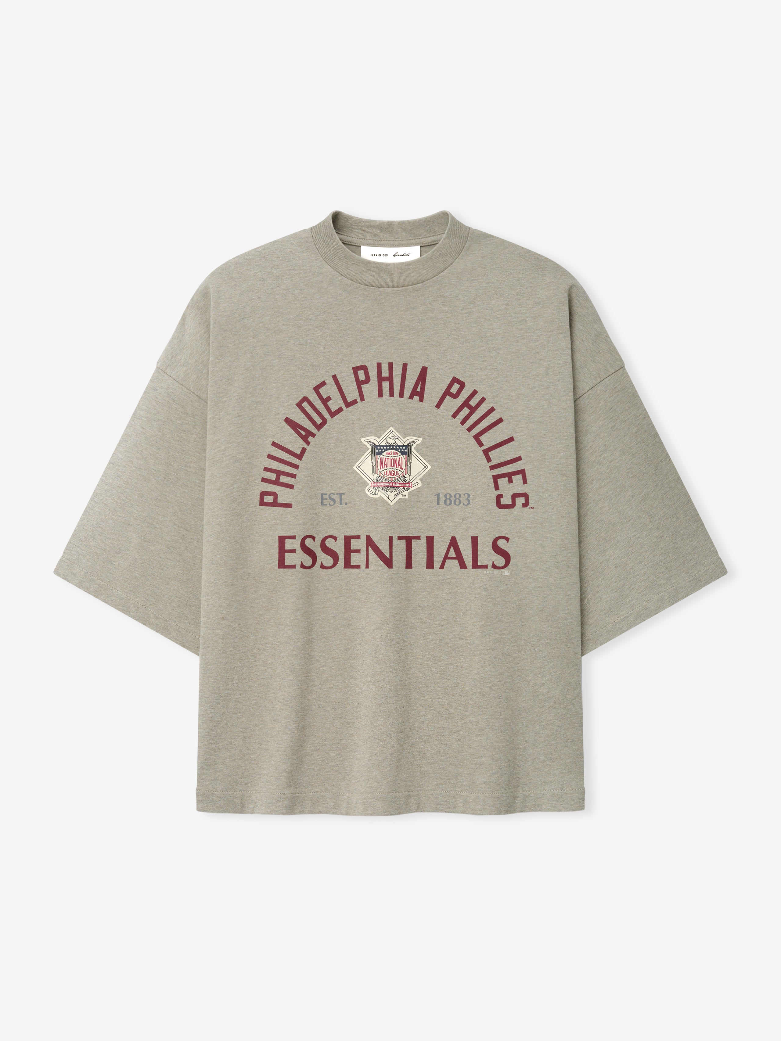 Phillies NL Merch Tee in a muted taupe fabric featuring maroon "Philadelphia Phillies Essentials" text arched over a vintage-style logo, designed as a casual, relaxed-fit top.