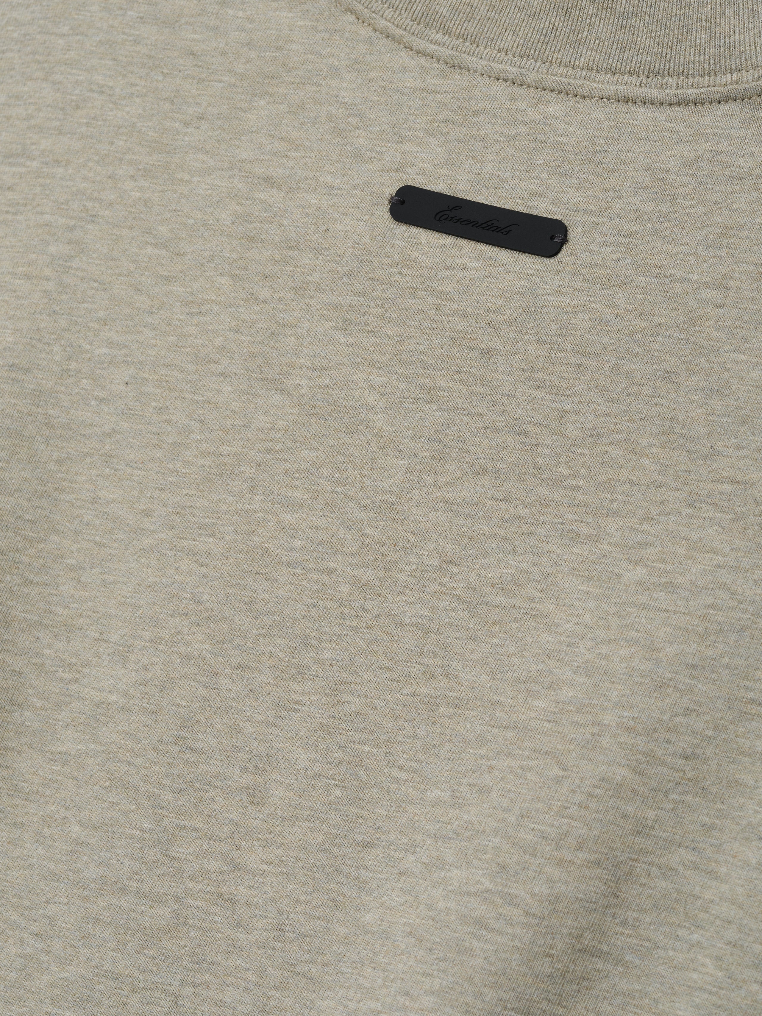Phillies NL Merch Tee in a soft seal heather fabric featuring a small black branded patch near the neckline, designed as a comfortable and stylish casual top.