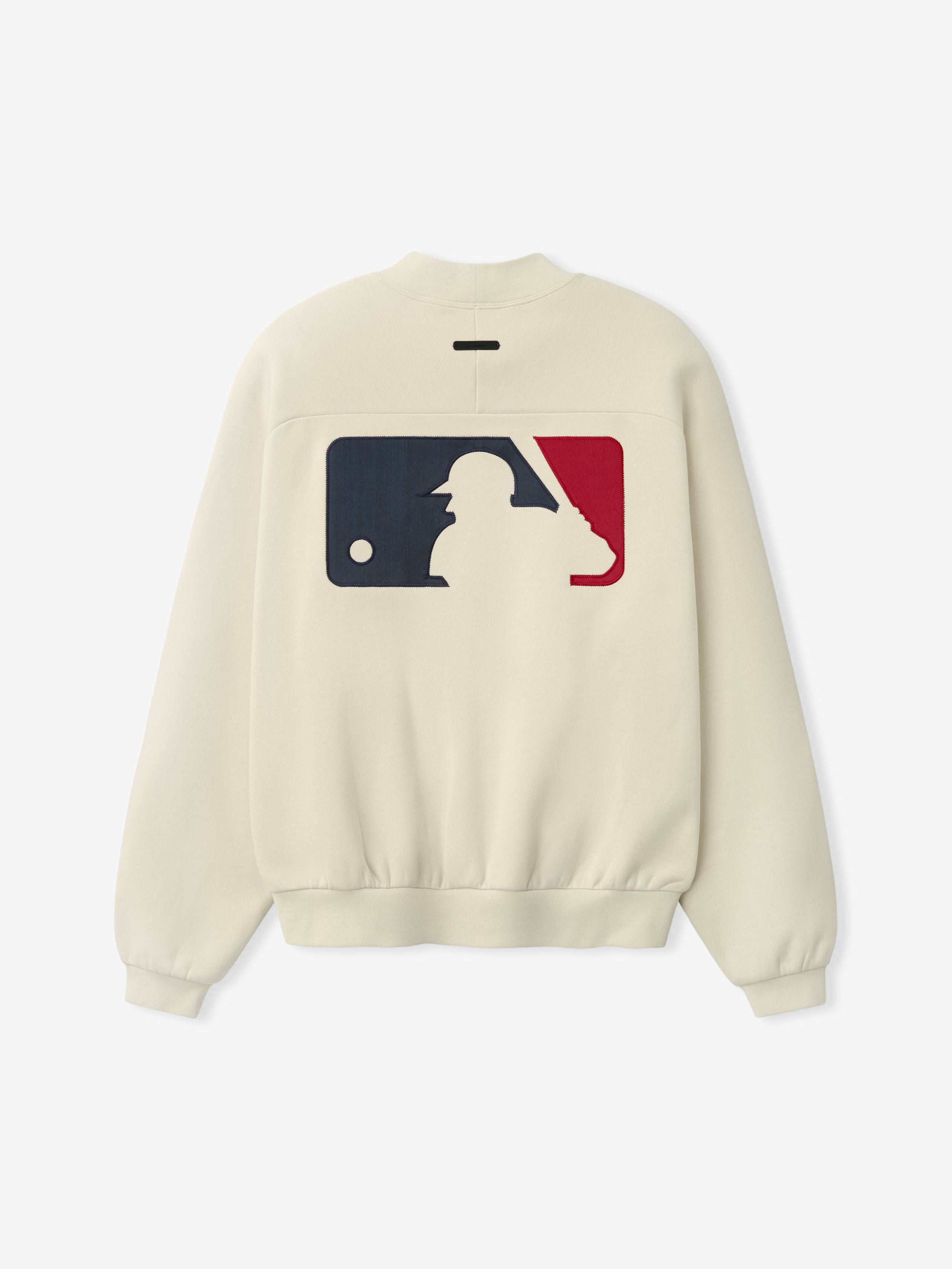 Mlb Sport Crewneck in a soft cream shade featuring a large contrasting navy and red baseball silhouette graphic on the back, designed as a stylish and casual top.