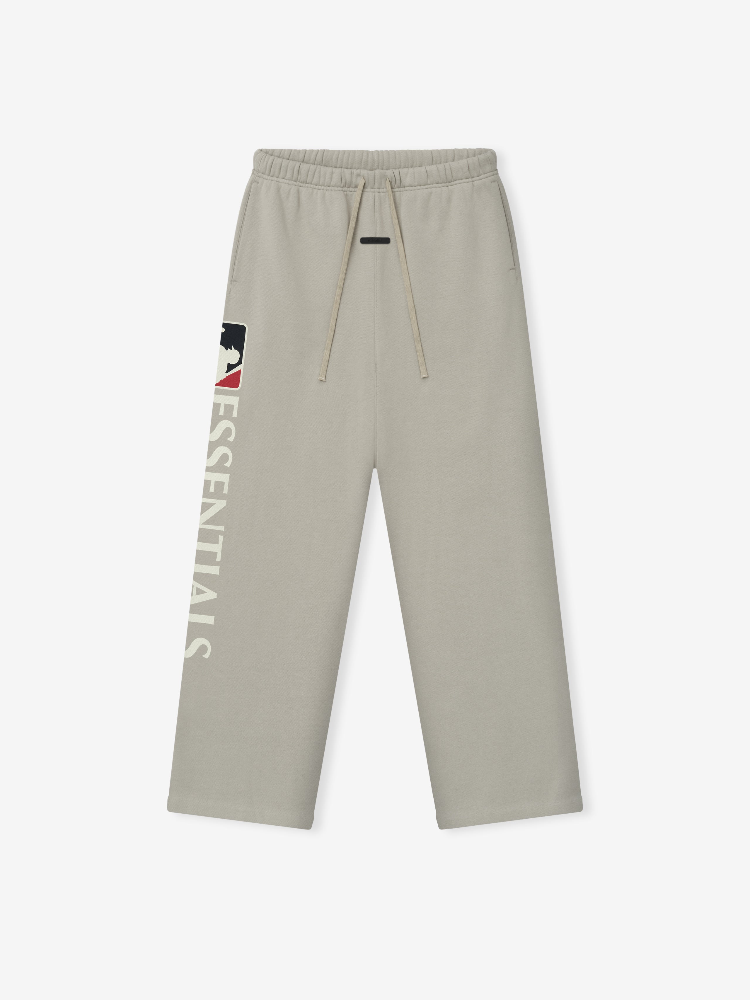 Light beige Mlb Lounge Sweatpant with a relaxed fit, featuring an elastic waistband with drawstrings and bold "ESSENTIALS" text alongside a logo graphic on the left leg.