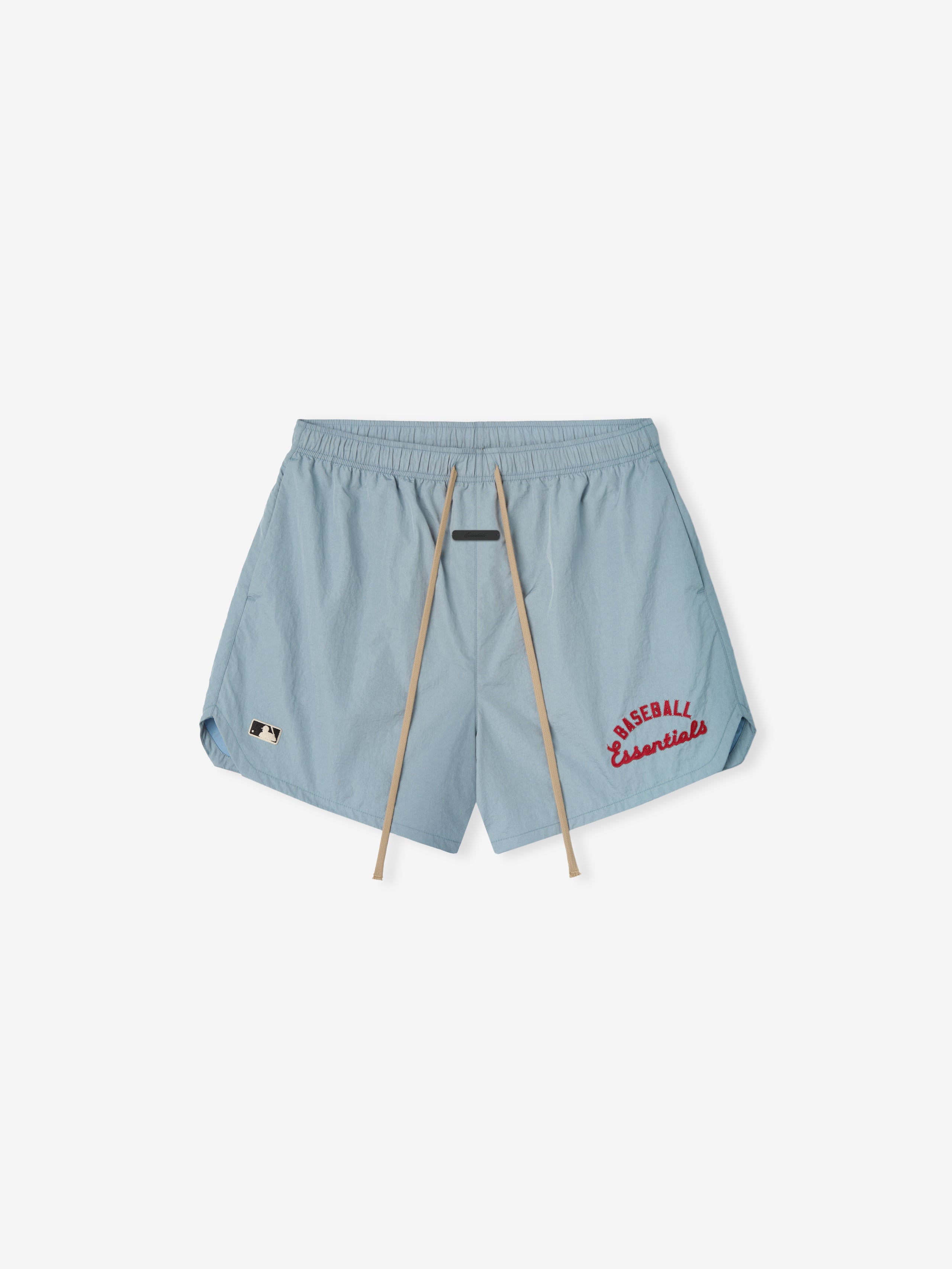 Mlb Gym Short in muted blue featuring beige drawstrings and red "Baseball Essentials" embroidery near the hem on lightweight casual athletic bottoms.