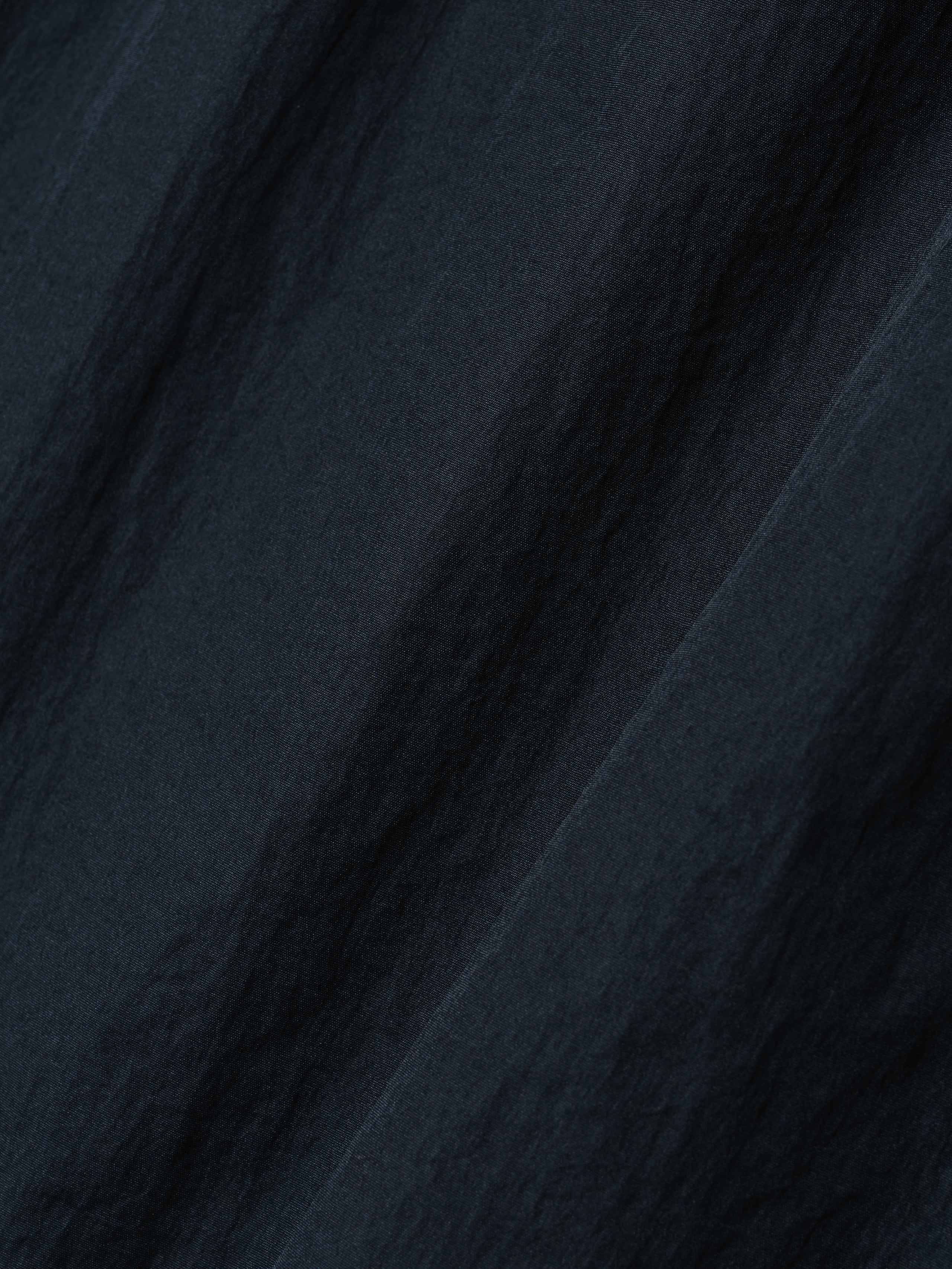 Yankees Gym Short fabric detail in dark sapphire, showcasing a lightweight textured material with a subtle sheen for breathable, comfortable bottoms.