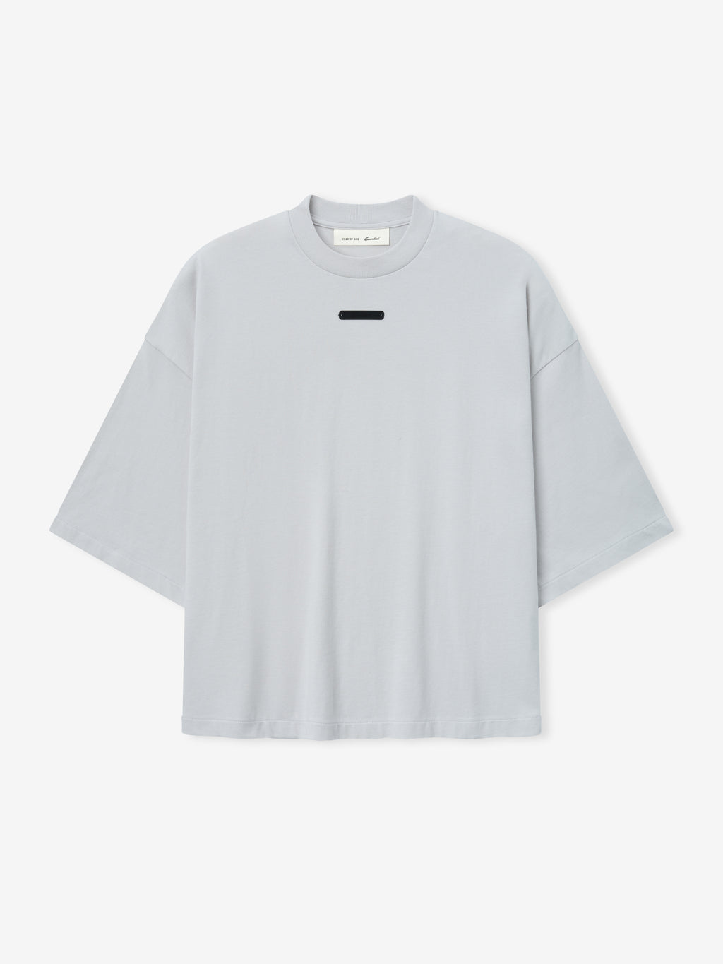 Merch Tee (Boxy) in light grey featuring an oversized boxy fit with dropped shoulders and a small rectangular black detail near the collar for a modern, minimalist top.