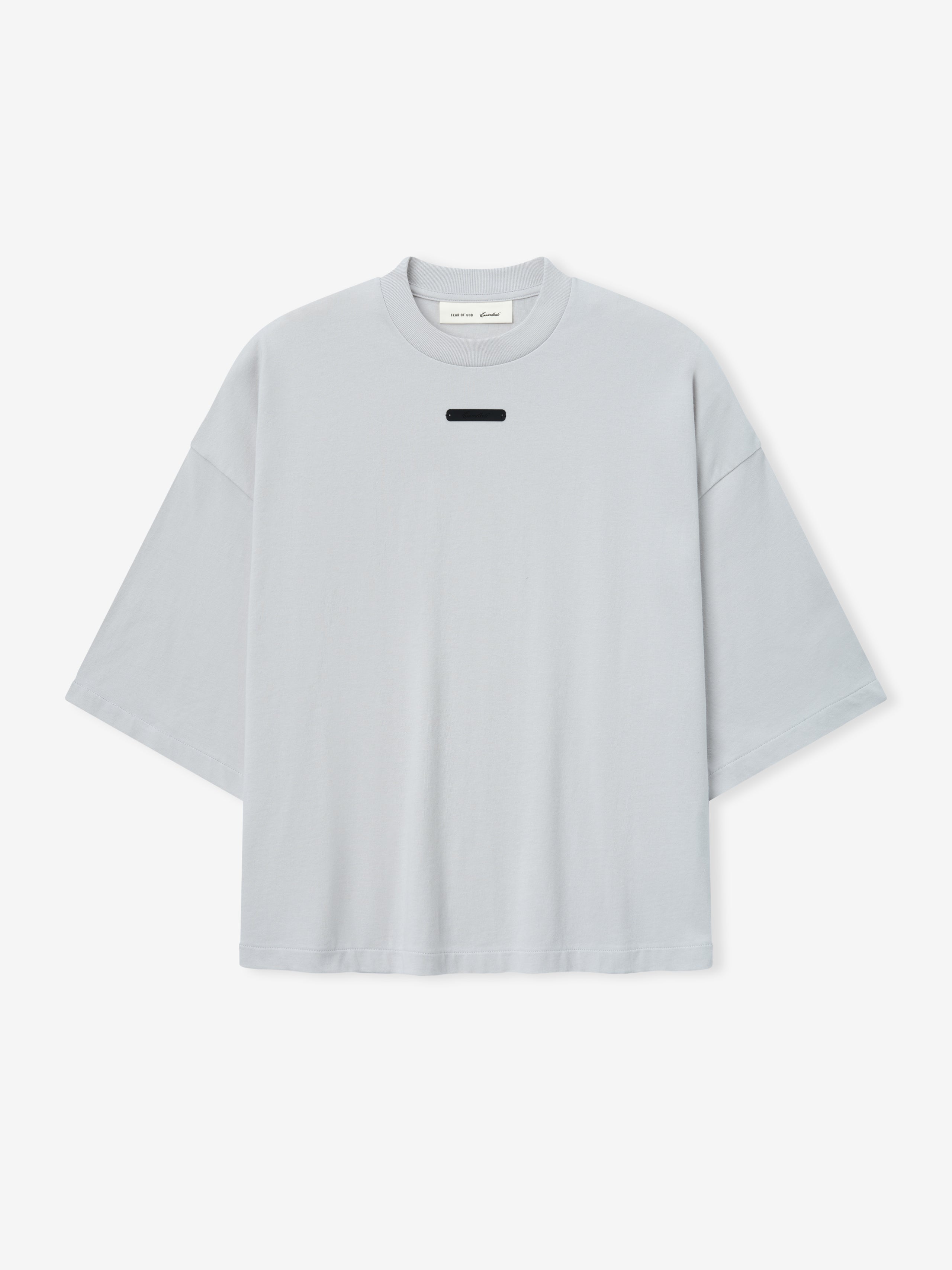 Merch Tee (Boxy) in light grey featuring an oversized boxy fit with dropped shoulders and a small rectangular black detail near the collar for a modern, minimalist top.