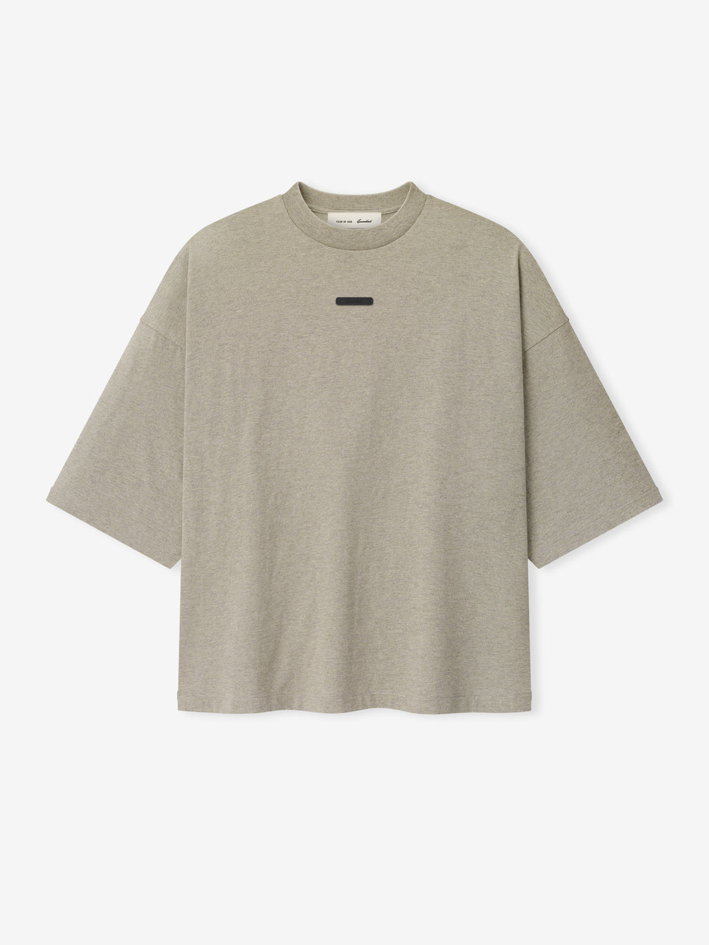 Merch Tee (Boxy) in muted taupe heather fabric featuring a relaxed oversized fit with dropped shoulders and a minimal black rectangular detail on the chest for a modern casual top.