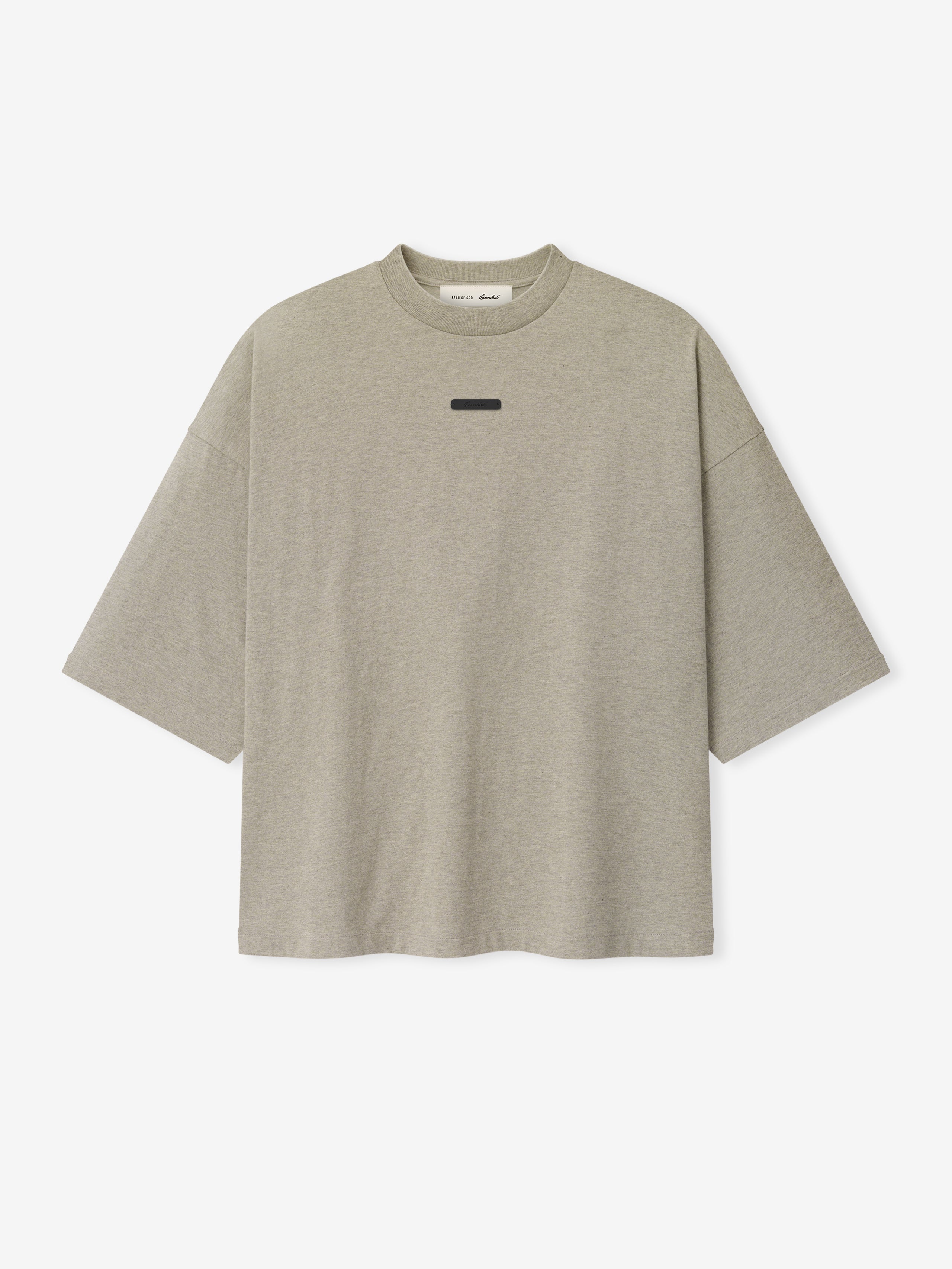 Merch Tee (Boxy) in muted taupe heather fabric featuring a relaxed oversized fit with dropped shoulders and a minimal black rectangular detail on the chest for a modern casual top.