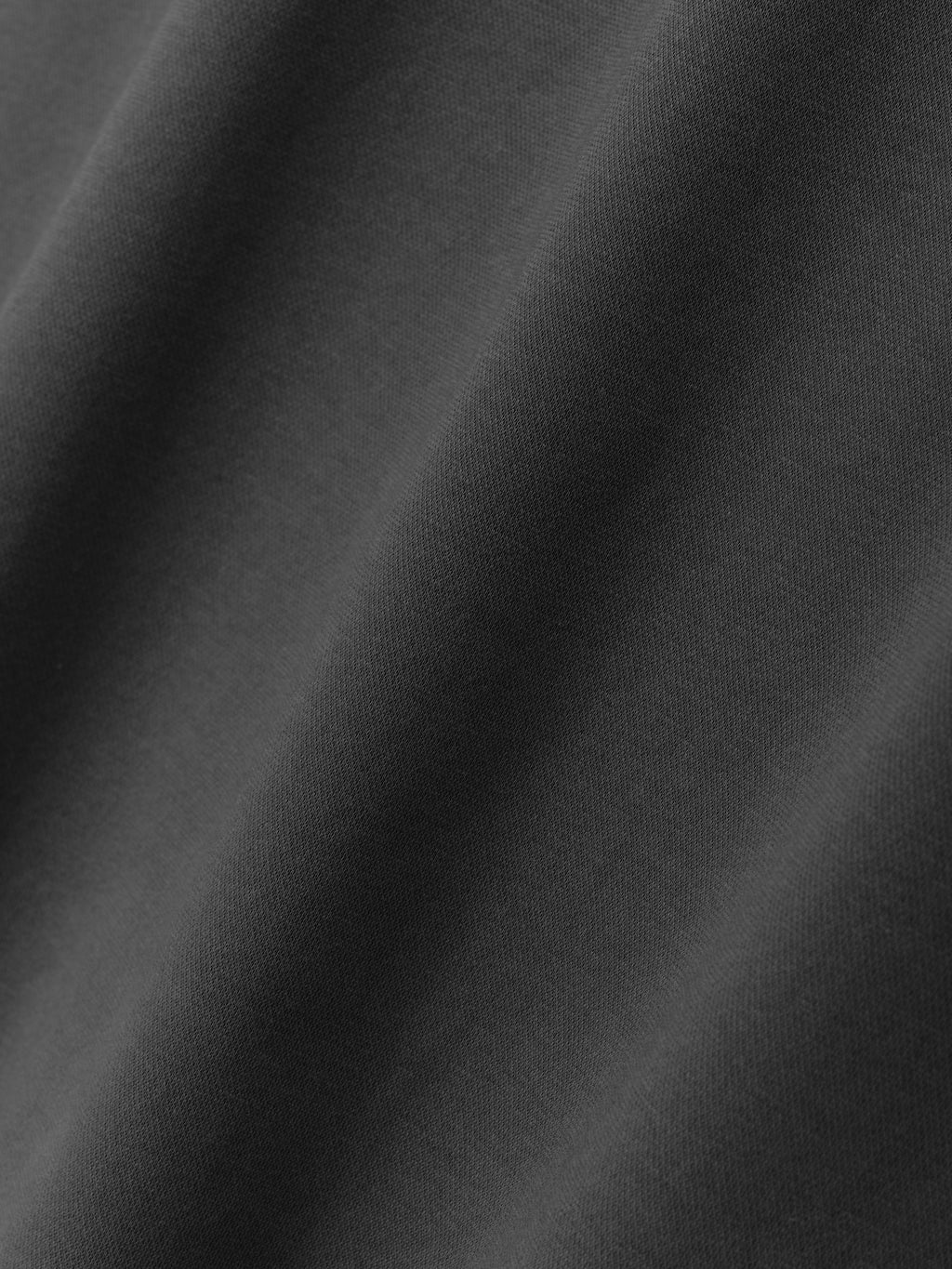 Ponte Modern Tee (Relaxed) in a dark iron grey shade, featuring a smooth, finely woven fabric with subtle texture, ideal for a comfortable and stylish casual top.