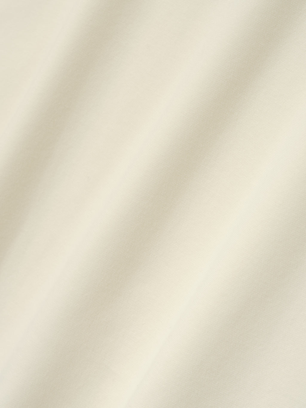 Ponte Modern Tee (Relaxed) in a light ivory shade featuring a smooth, soft fabric with a relaxed fit, designed for a comfortable and stylish casual top.