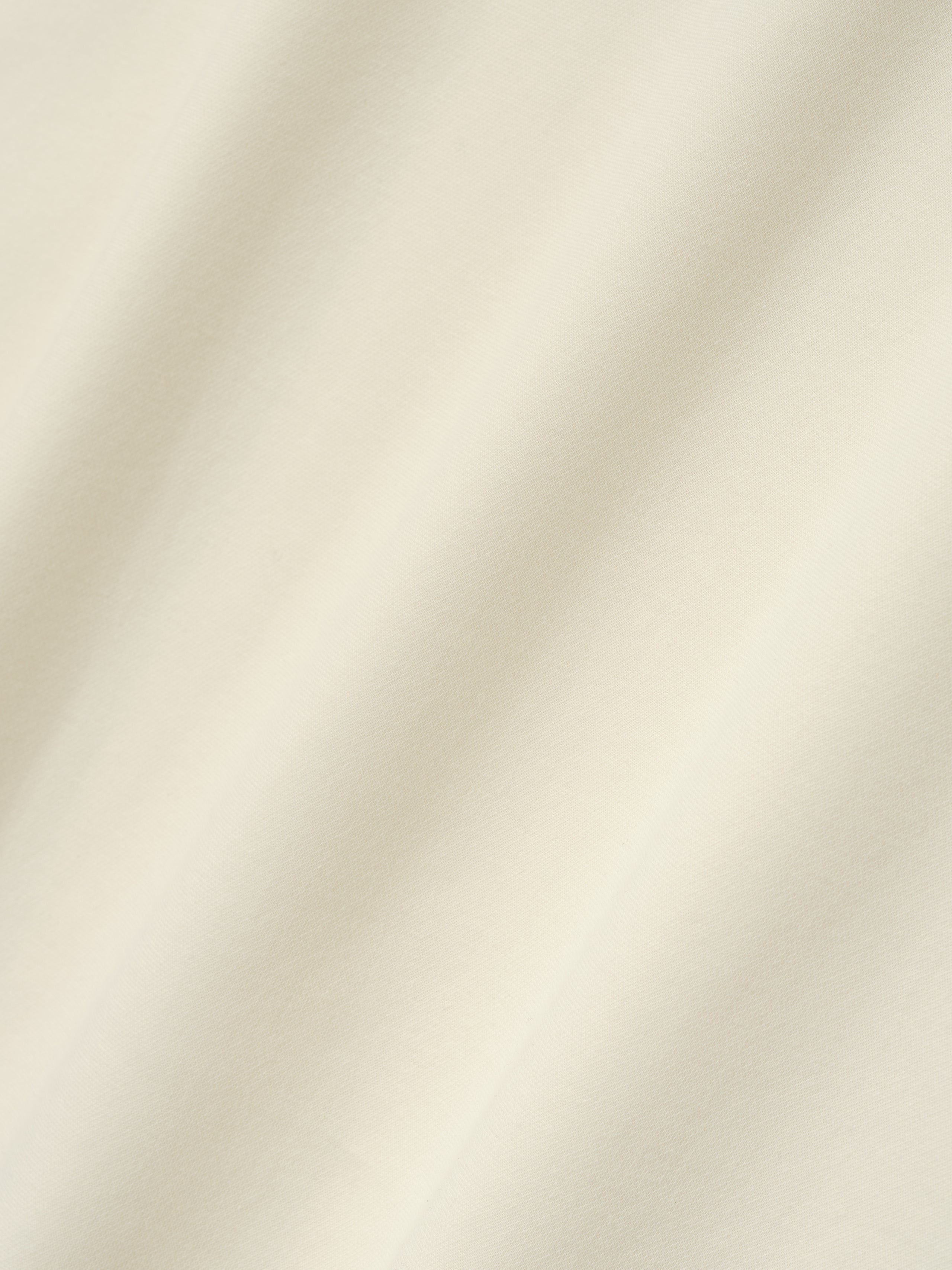 Ponte Modern Tee (Relaxed) in a light ivory shade featuring a smooth, soft fabric with a relaxed fit, designed for a comfortable and stylish casual top.