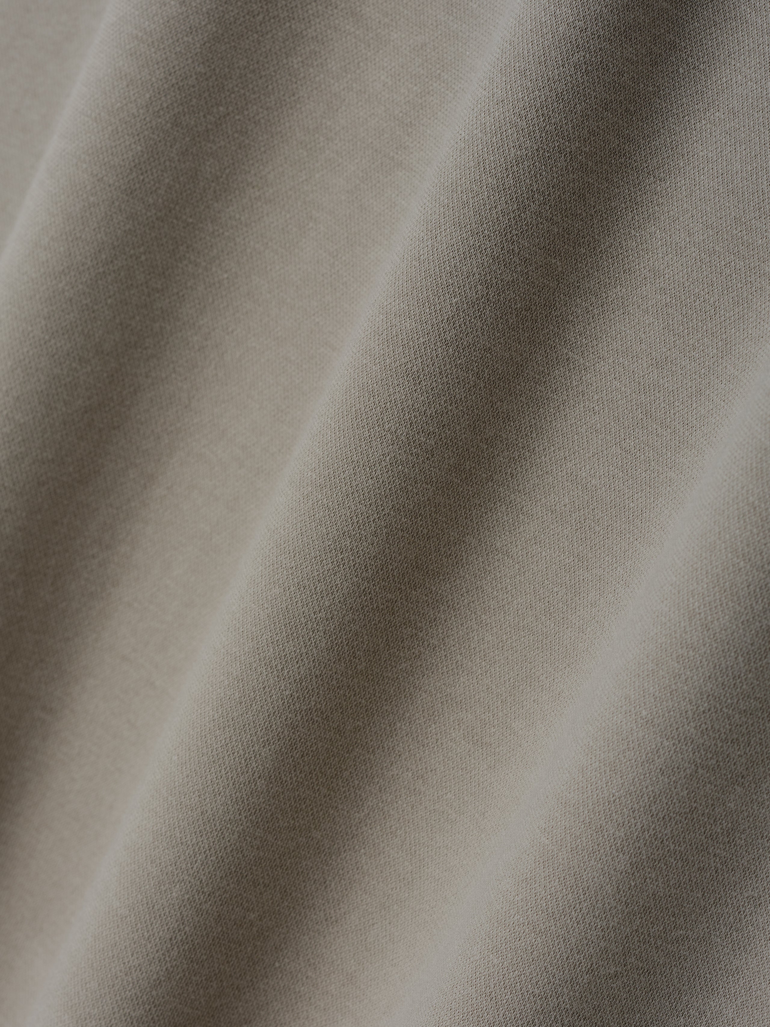 Ponte Modern Tee (Relaxed) fabric in a soft seal tone with a smooth, fine knit texture, ideal for a comfortable and versatile casual top.