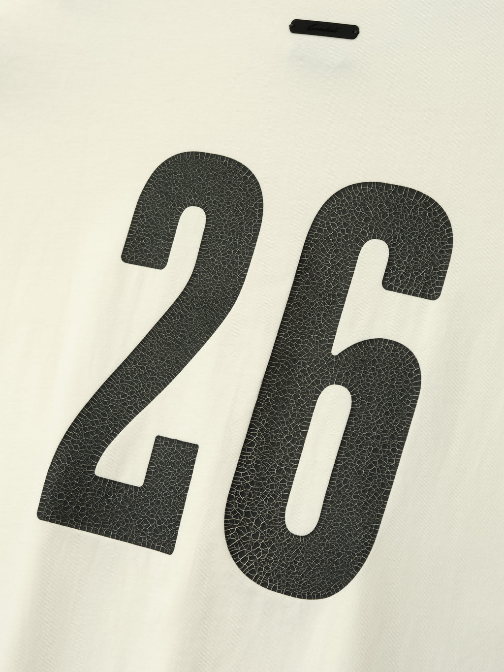 Merch Tee (Boxy) in creamy ivory fabric featuring a textured black number 26 printed on the back for a unique athletic-inspired casual top.