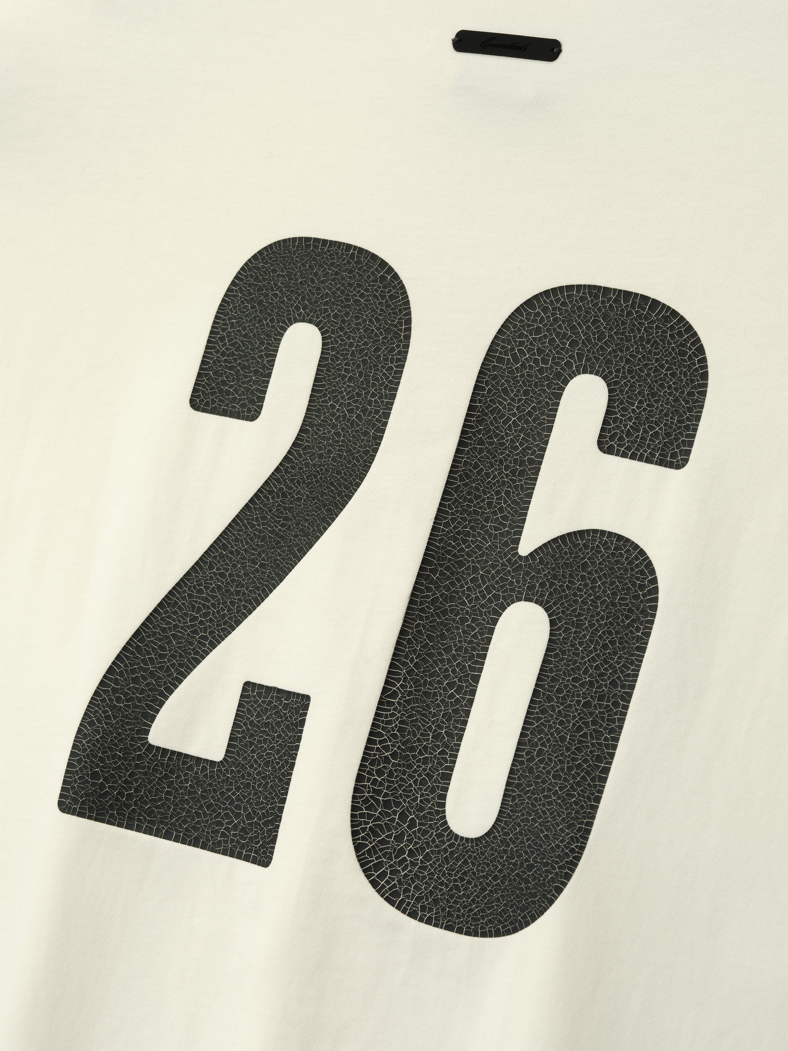 Merch Tee (Boxy) in creamy ivory fabric featuring a textured black number 26 printed on the back for a unique athletic-inspired casual top.