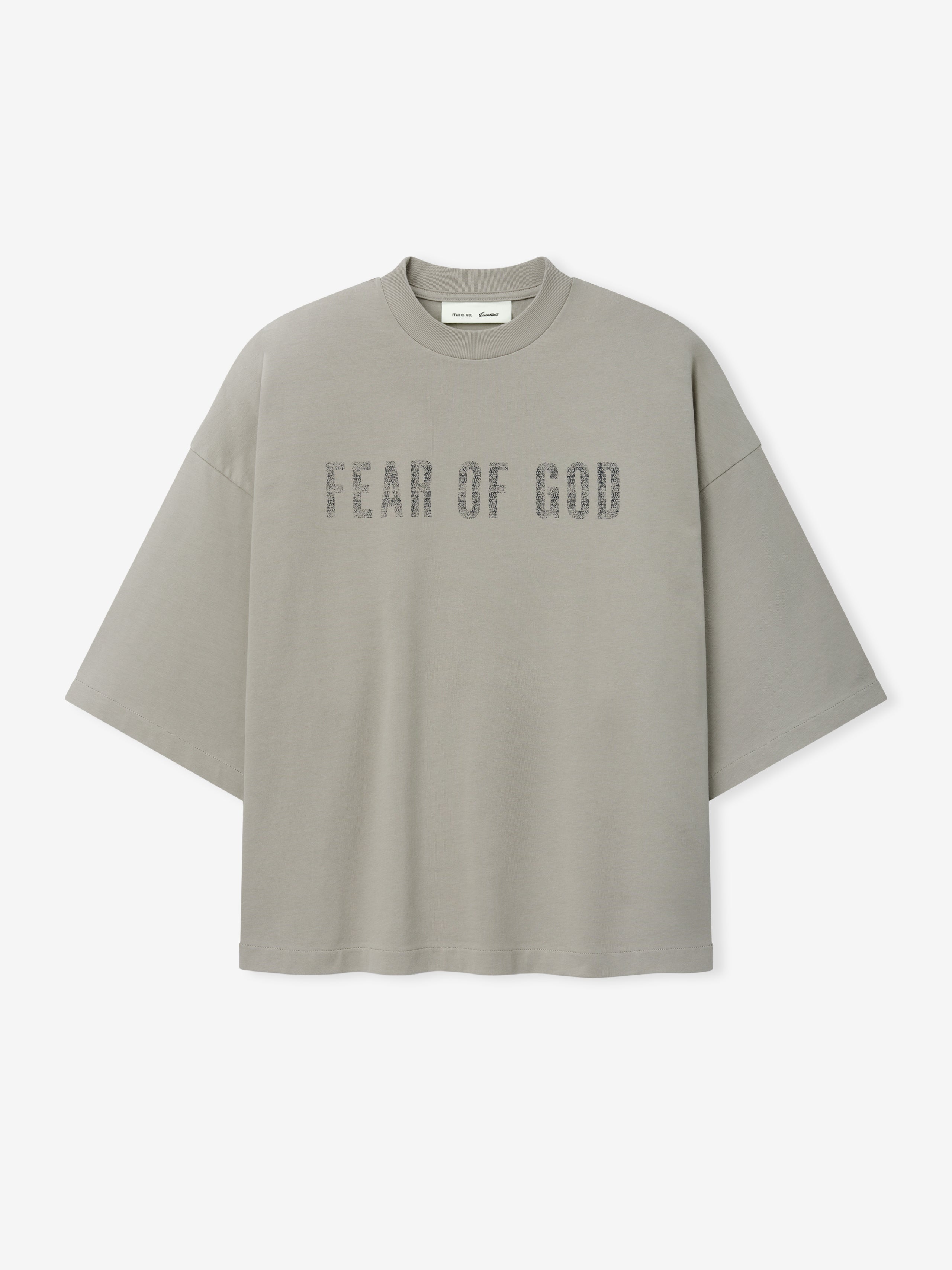 Merch Tee (Boxy) in muted grey with an oversized fit and dropped shoulders, featuring distressed Fear of God lettering across the chest for a modern streetwear-inspired top.
