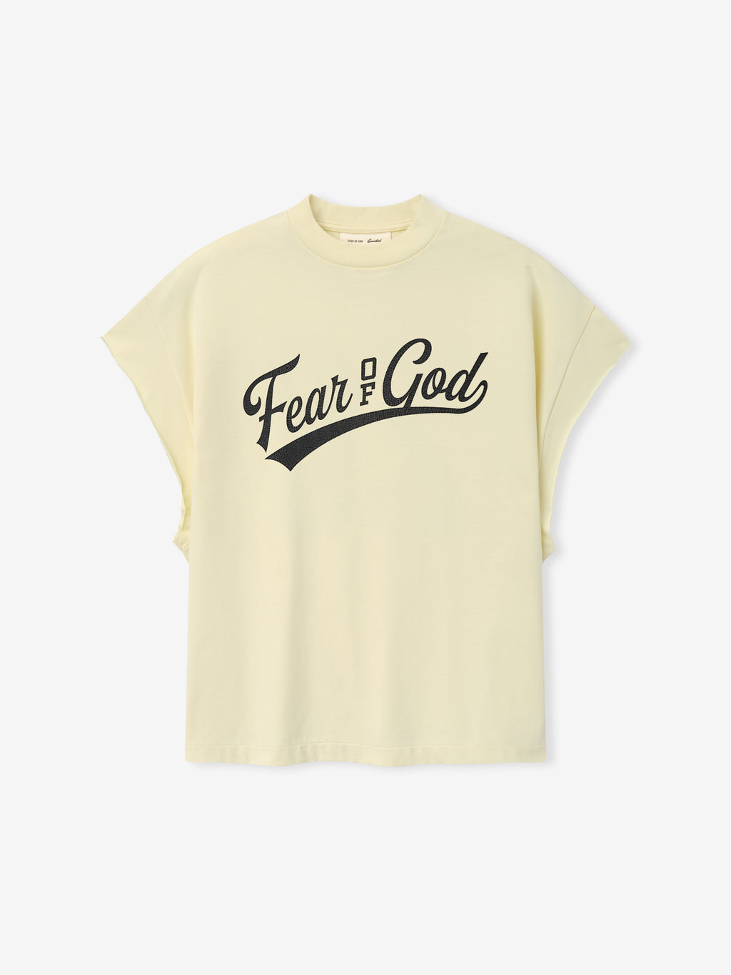 Cut Off 90'S Tee in a soft chalk hue featuring a bold black Fear of God script logo across the chest, designed with a relaxed fit and dropped sleeves for an effortless look.