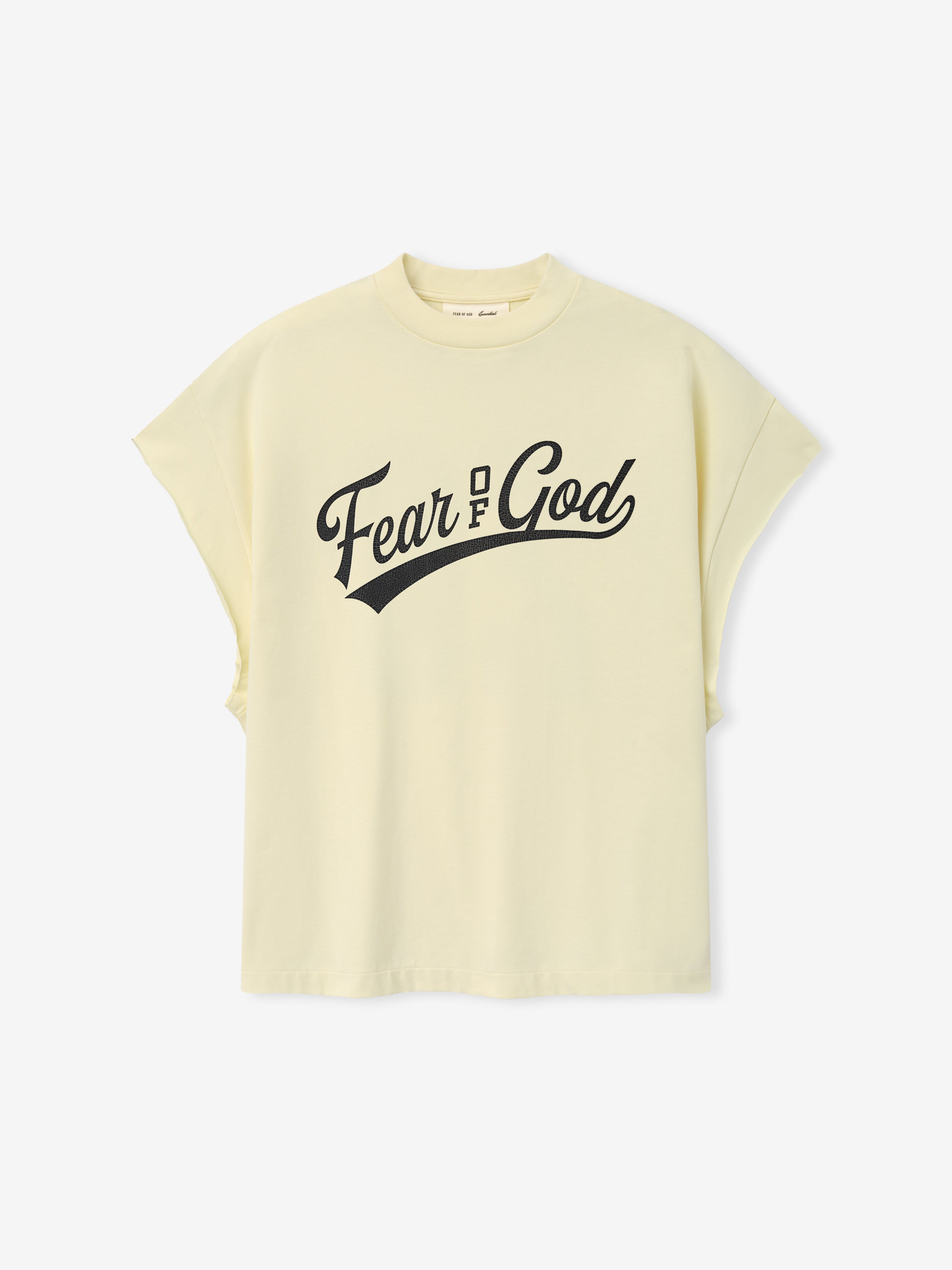Cut Off 90'S Tee in a soft chalk hue featuring a bold black Fear of God script logo across the chest, designed with a relaxed fit and dropped sleeves for an effortless look.