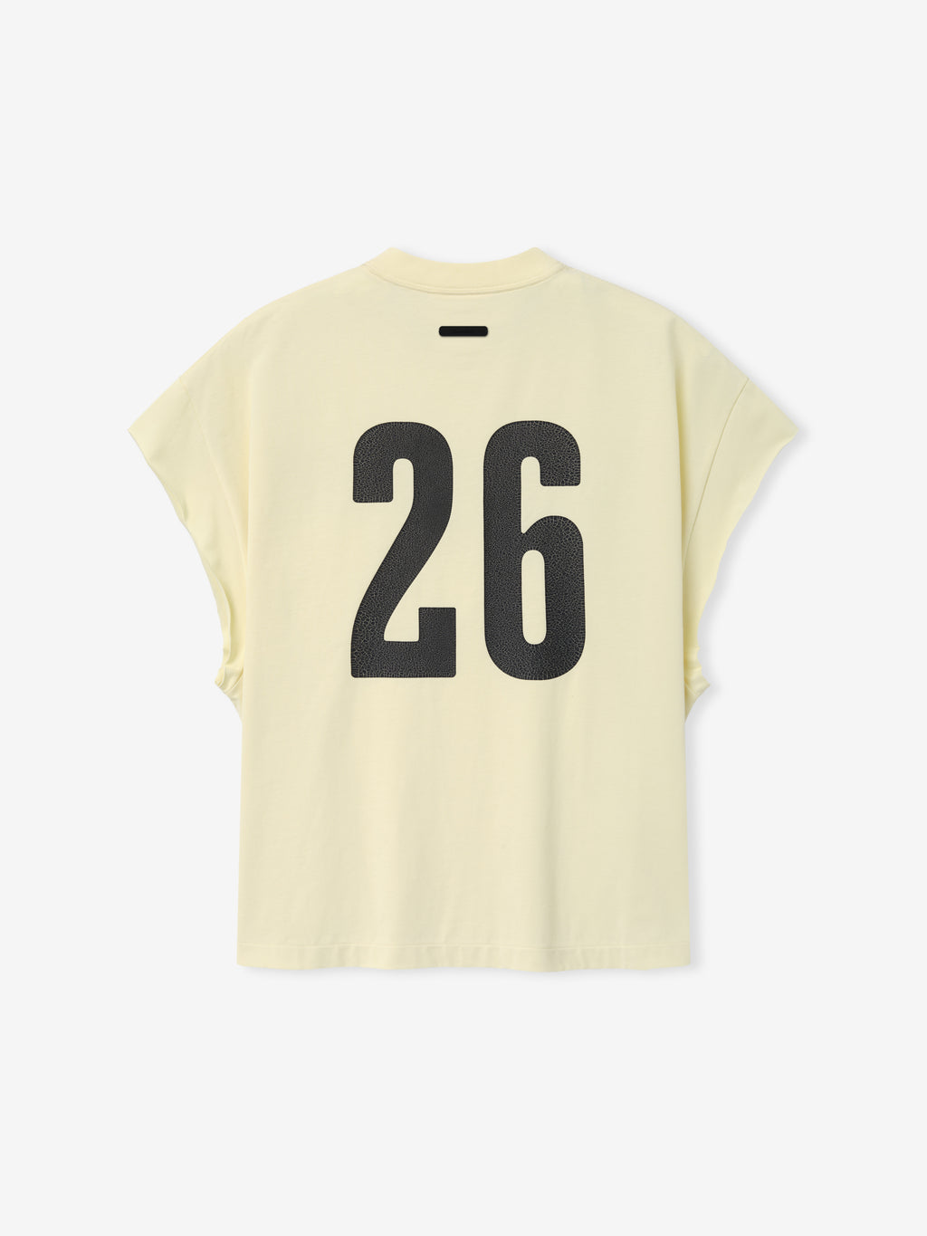 Cut Off 90'S Tee in a soft pale yellow shade featuring a bold black number 26 printed on the back, designed with a relaxed fit and dropped cap sleeves for a vintage-inspired casual top.