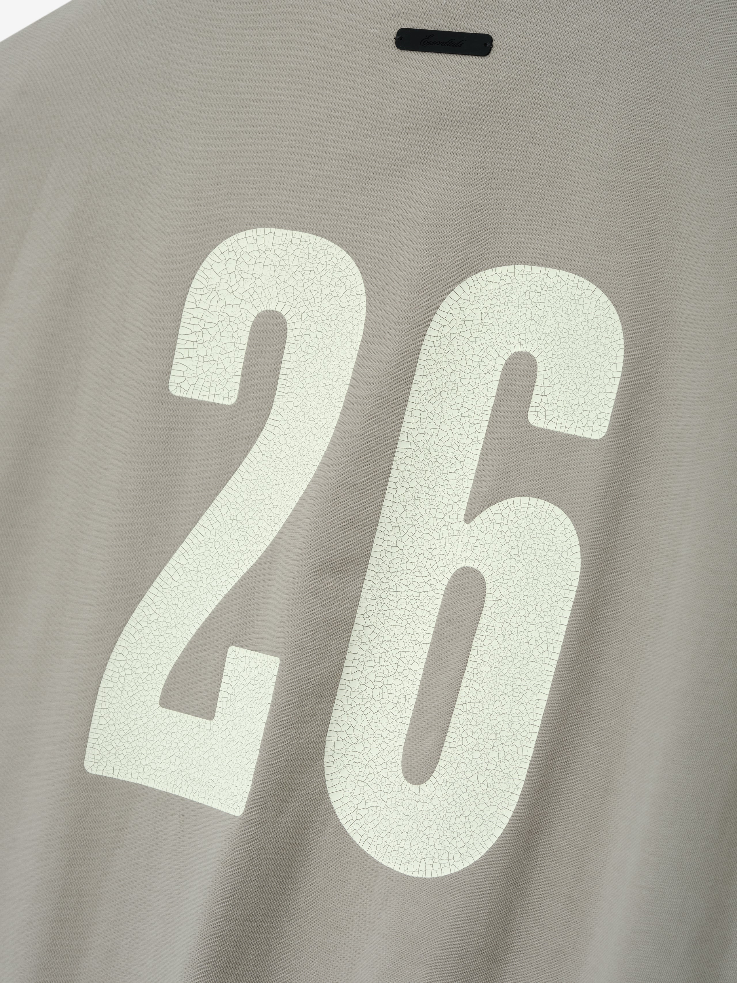 Cut Off 90'S Tee in a muted taupe shade featuring a large off-white cracked number 26 on the back, crafted from soft cotton for a vintage-inspired casual top.